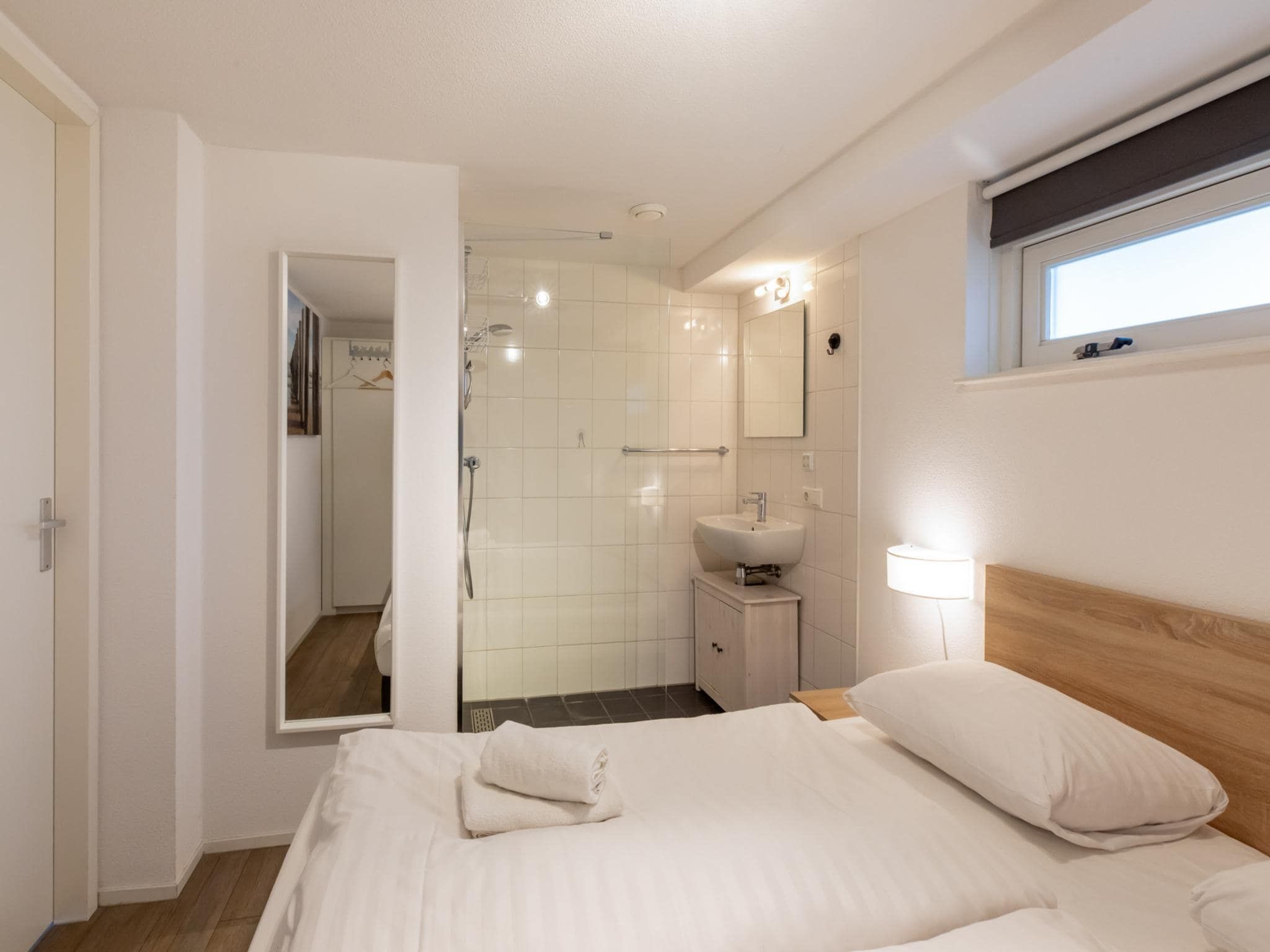 Een slaapkamer van Zonnedorp 18 Duinhuis Renesse | Relaxed beach holiday for the whole family in Renesse