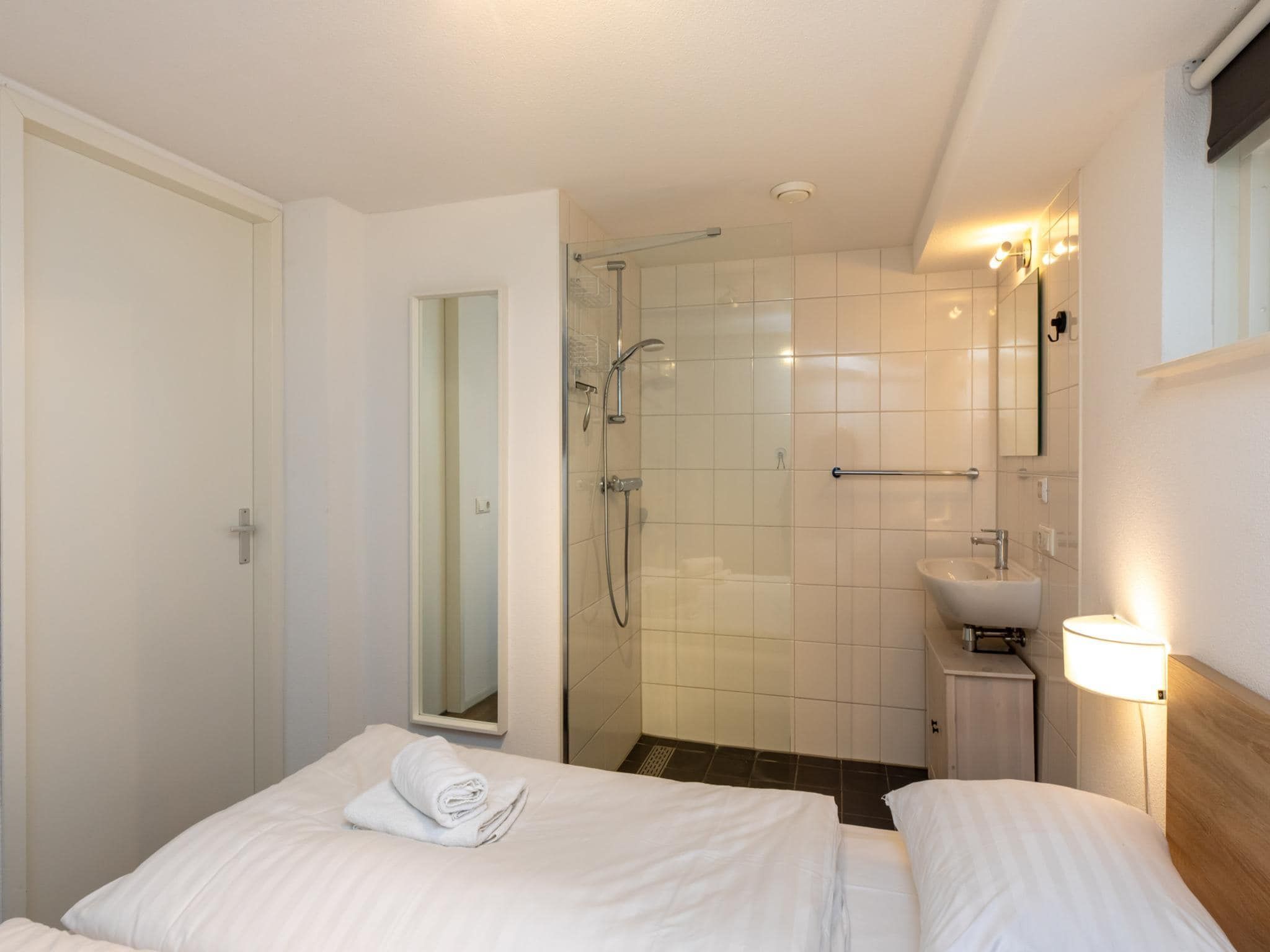 Een slaapkamer van Zonnedorp 18 Duinhuis Renesse | Relaxed beach holiday for the whole family in Renesse