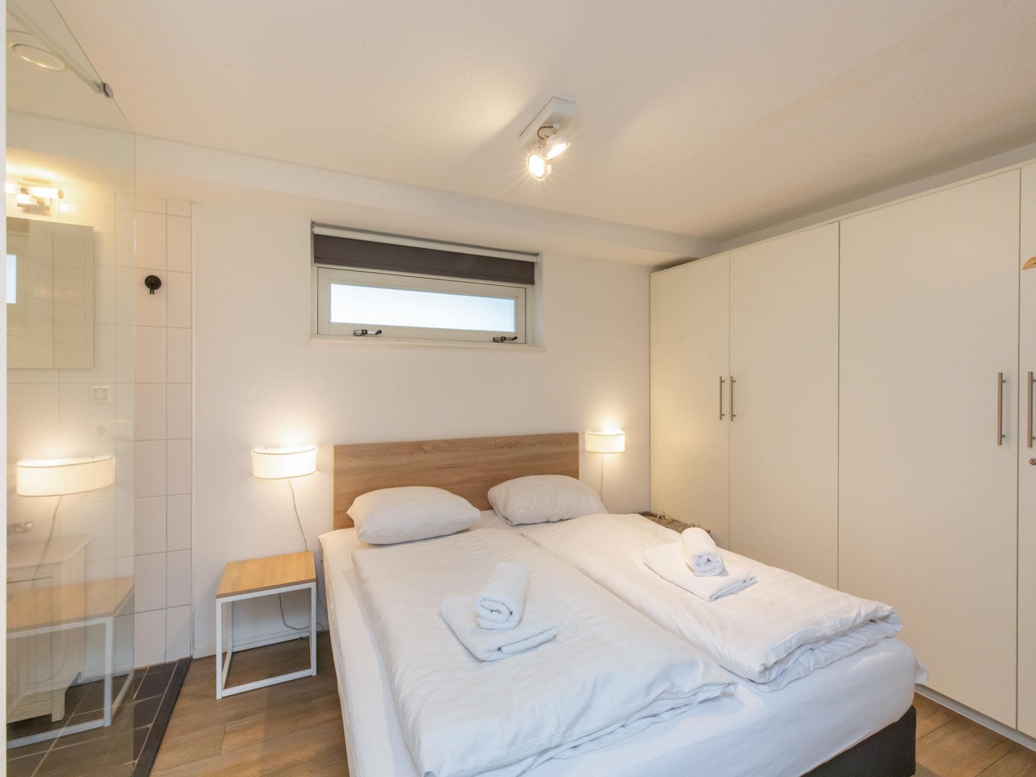 Een slaapkamer van Zonnedorp 18 Duinhuis Renesse | Relaxed beach holiday for the whole family in Renesse