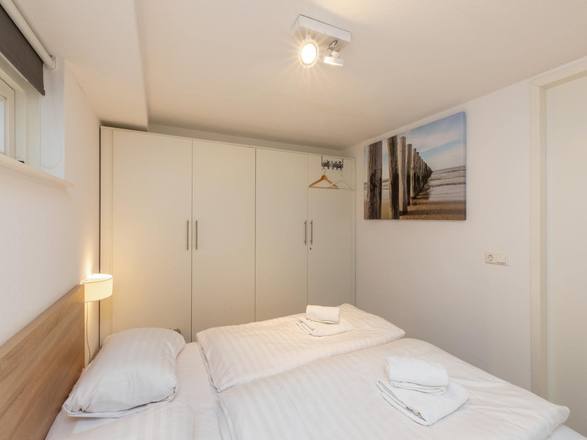 Een slaapkamer van Zonnedorp 18 Duinhuis Renesse | Relaxed beach holiday for the whole family in Renesse