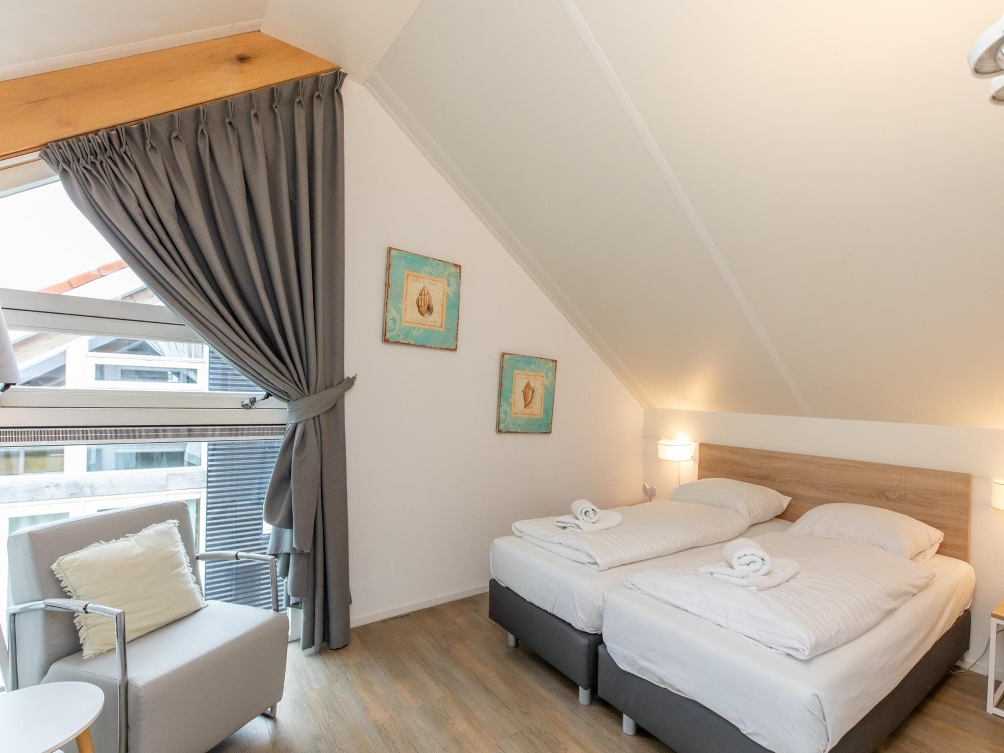 Een slaapkamer van Zonnedorp 18 Duinhuis Renesse | Relaxed beach holiday for the whole family in Renesse