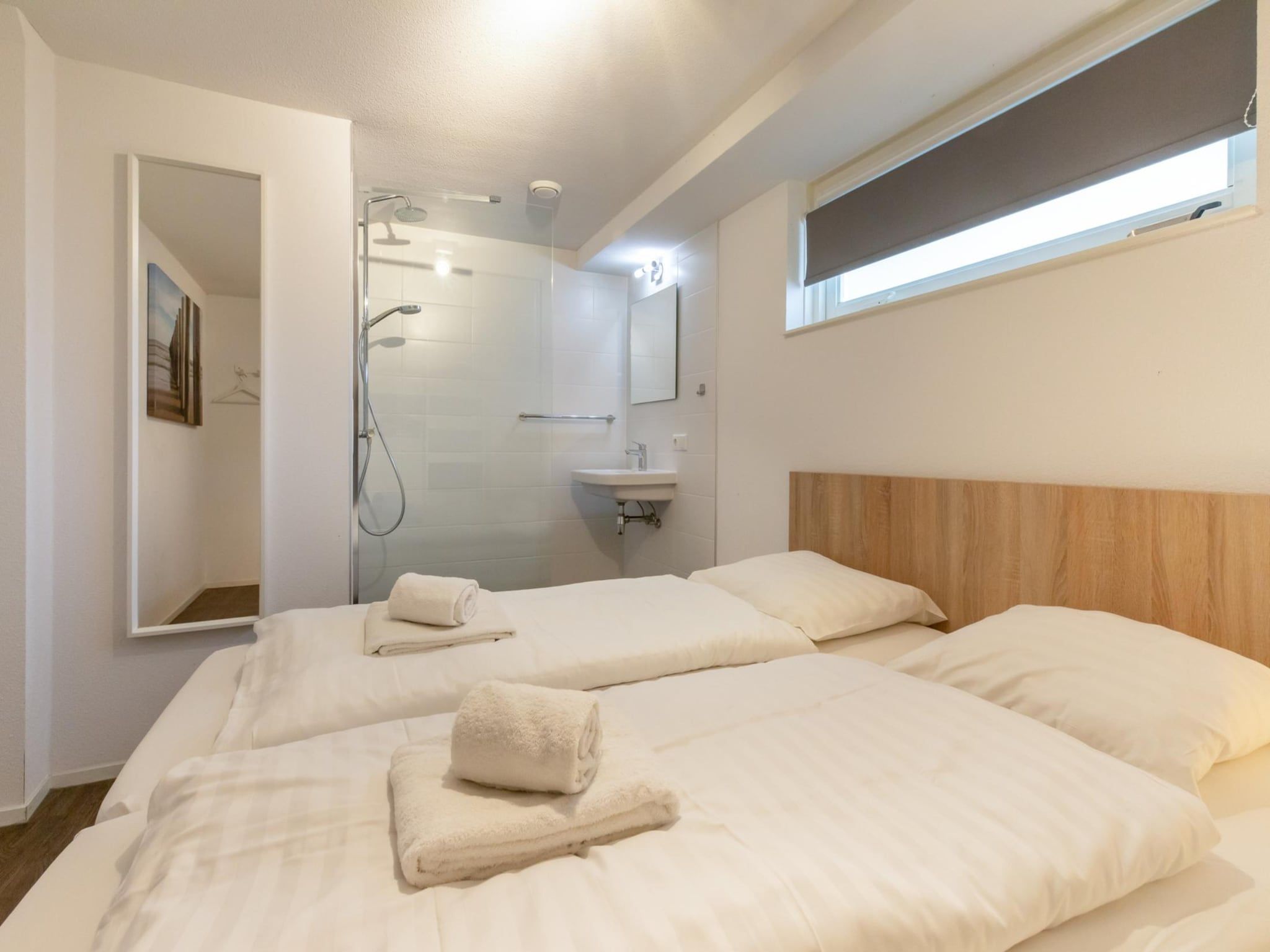 Een slaapkamer van Zonnedorp 23 Zeeland Huis Renesse: Luxury Beach Holiday | Close to North Sea in Renesse