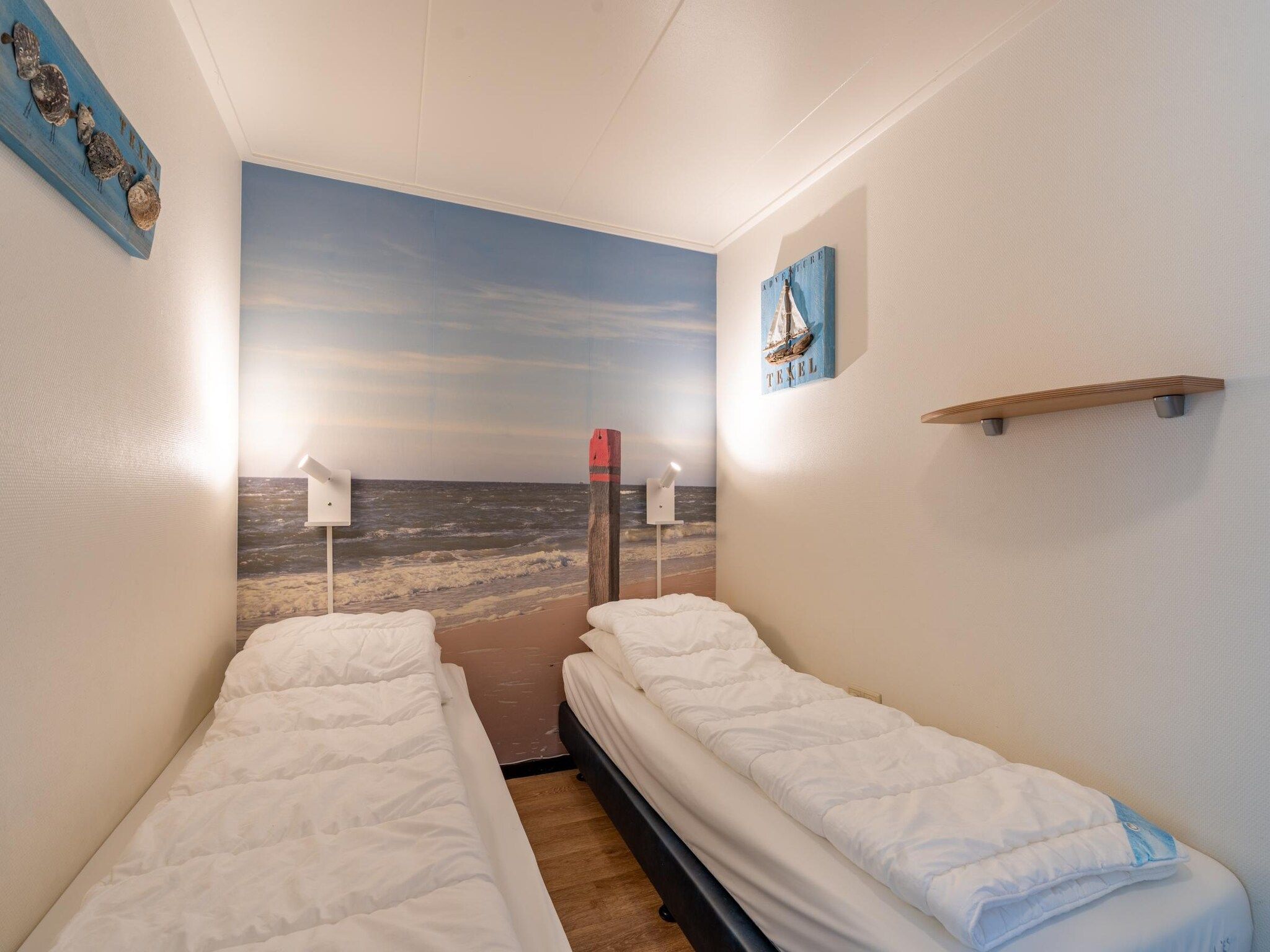 Een slaapkamer van De Anna 218 - Zee in De Koog