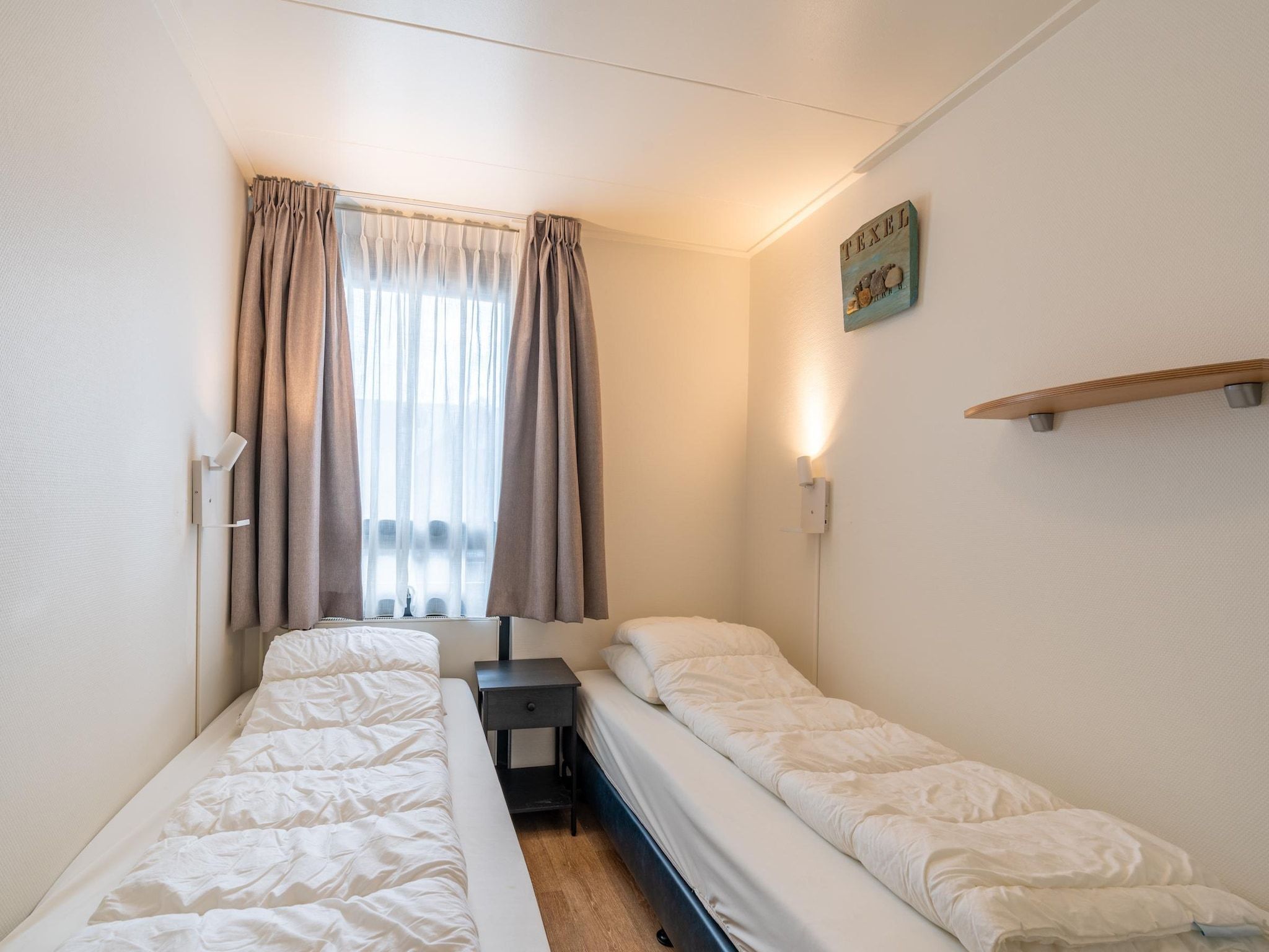 Een slaapkamer van De Anna 218 - Zee in De Koog