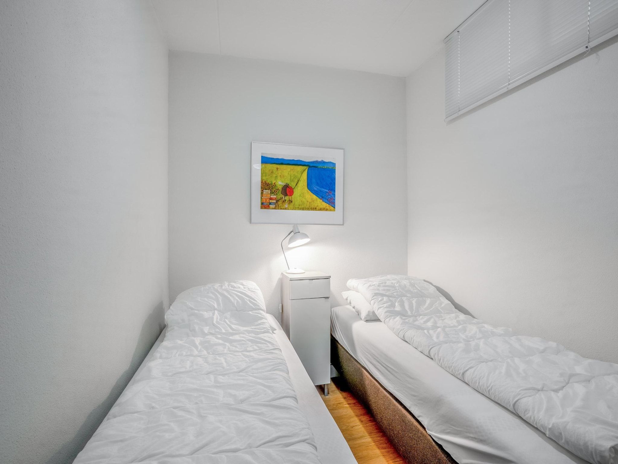 Een slaapkamer van Juliana 052 in De Koog