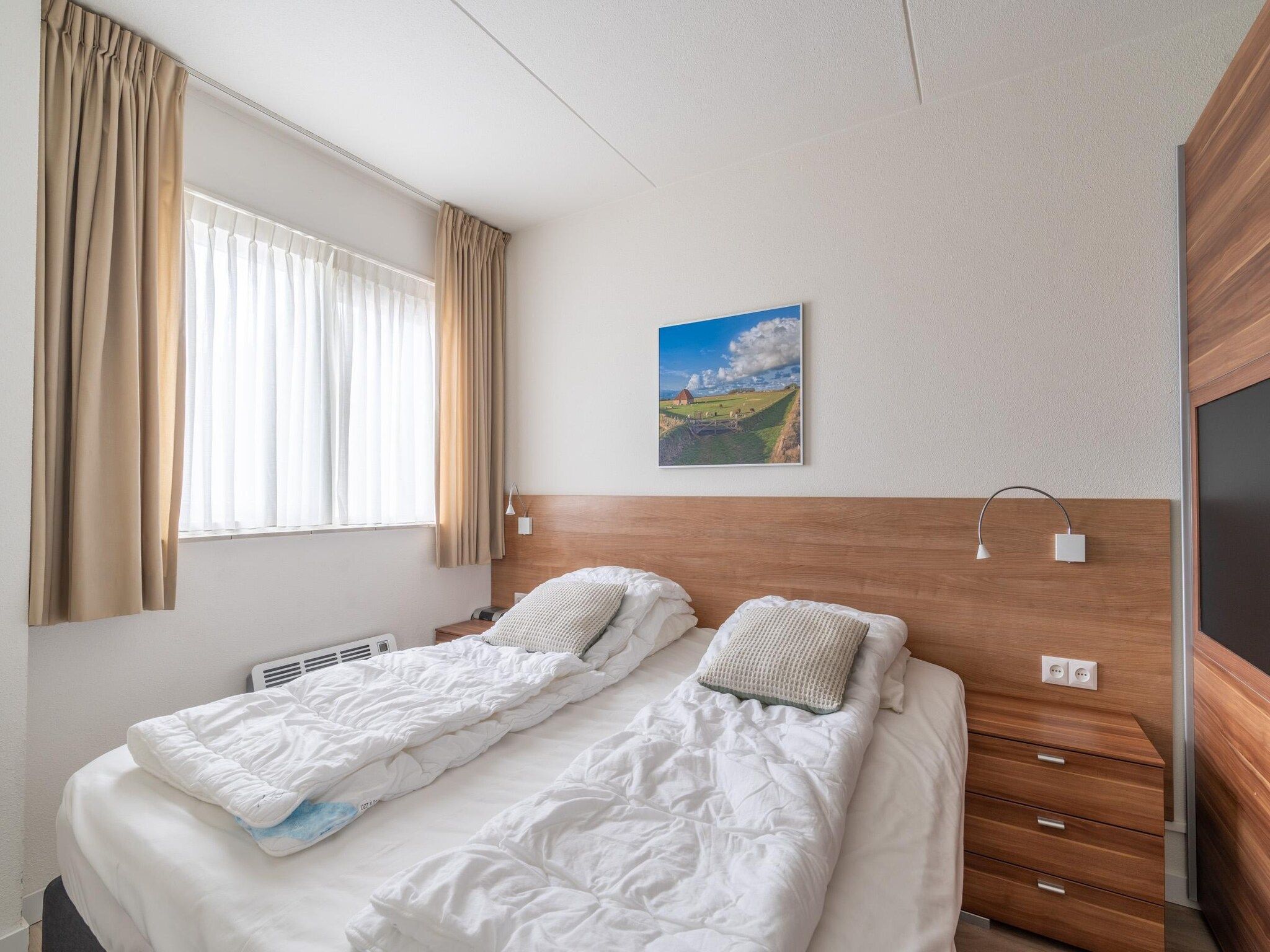 Een slaapkamer van Juliana 138 in De Koog