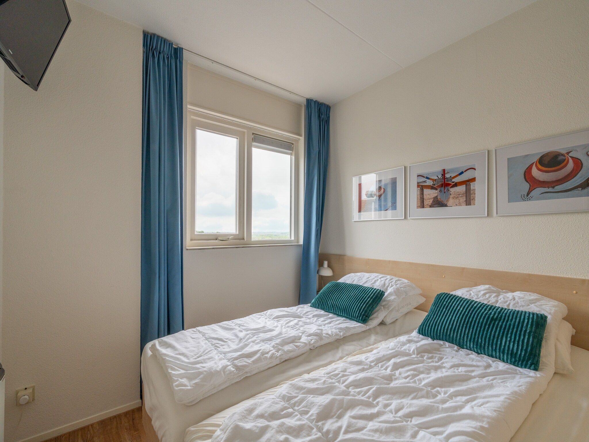 Een slaapkamer van Juliana 146 in De Koog