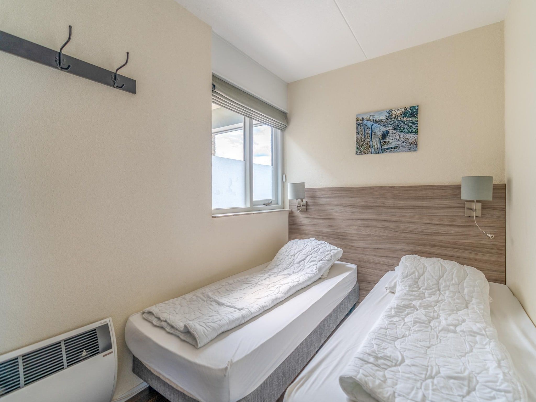 Een slaapkamer van Juliana 156 in De Koog