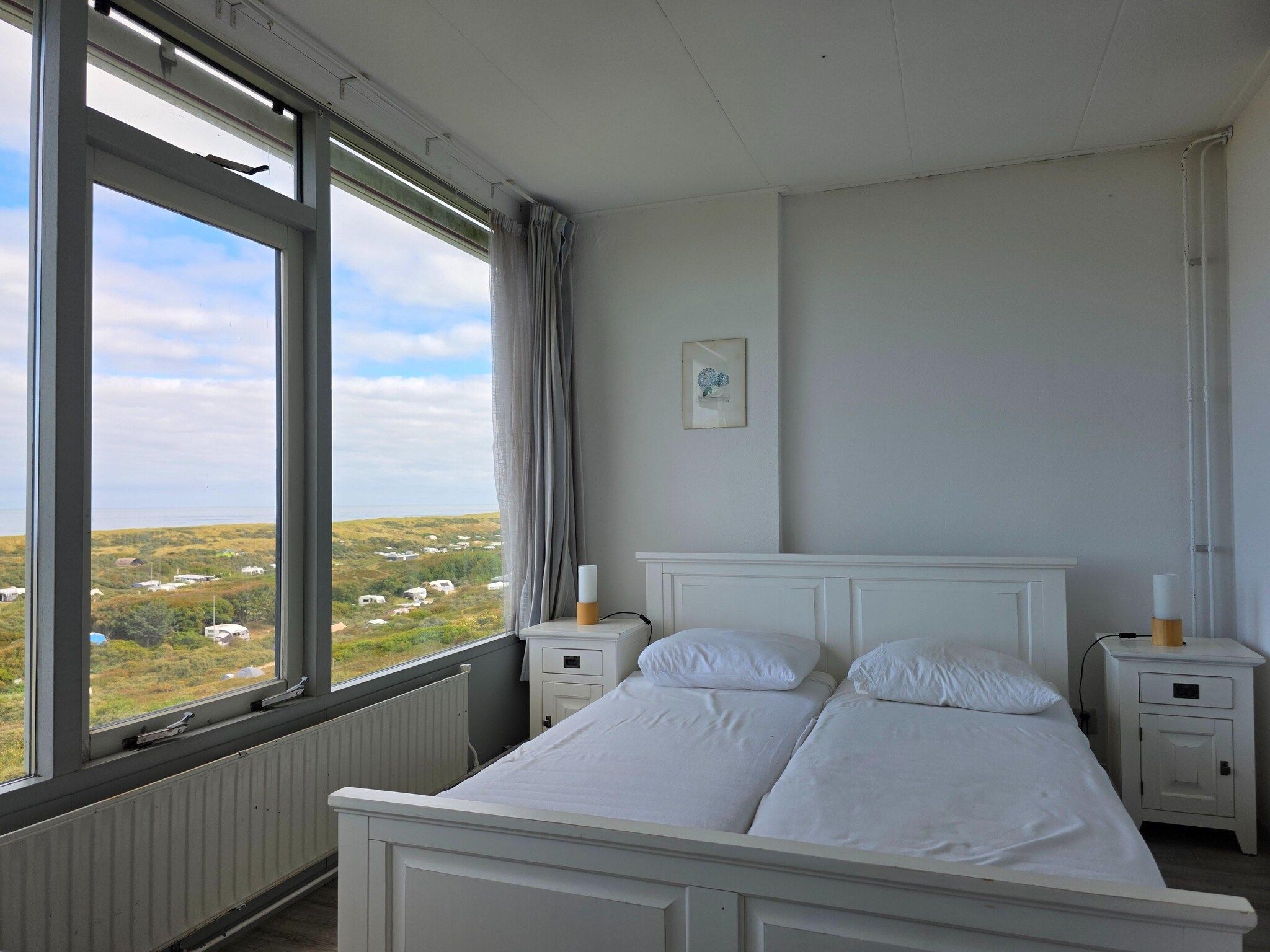 Een slaapkamer van Juliana 162 in De Koog