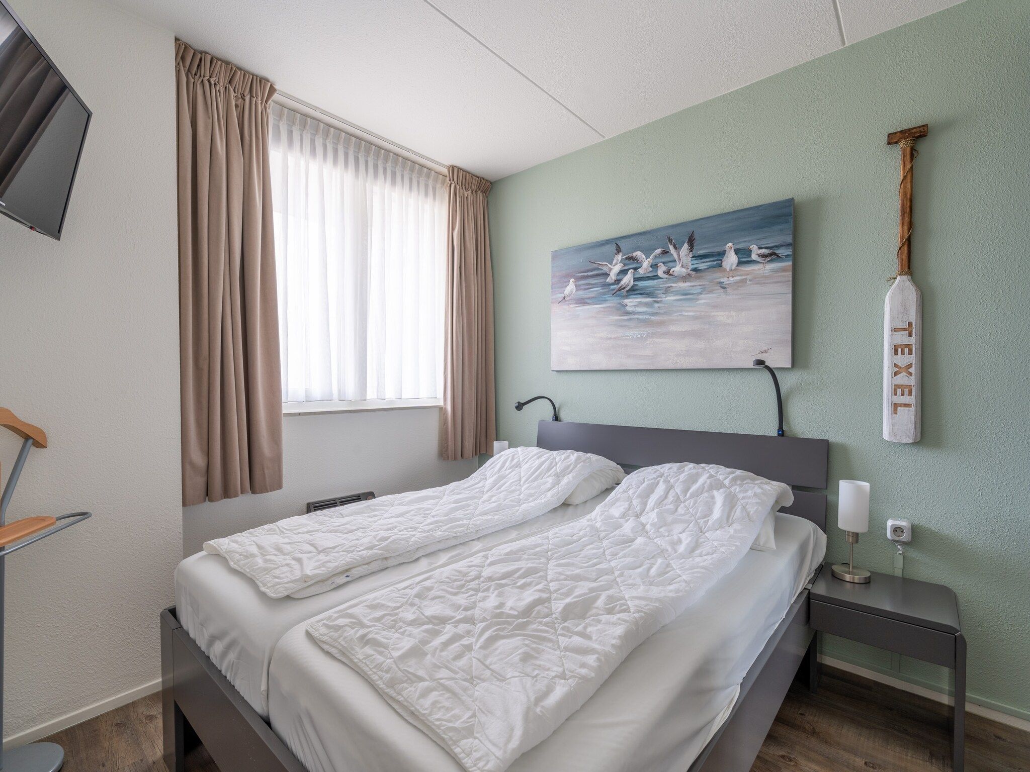 Een slaapkamer van Juliana 088 in De Koog
