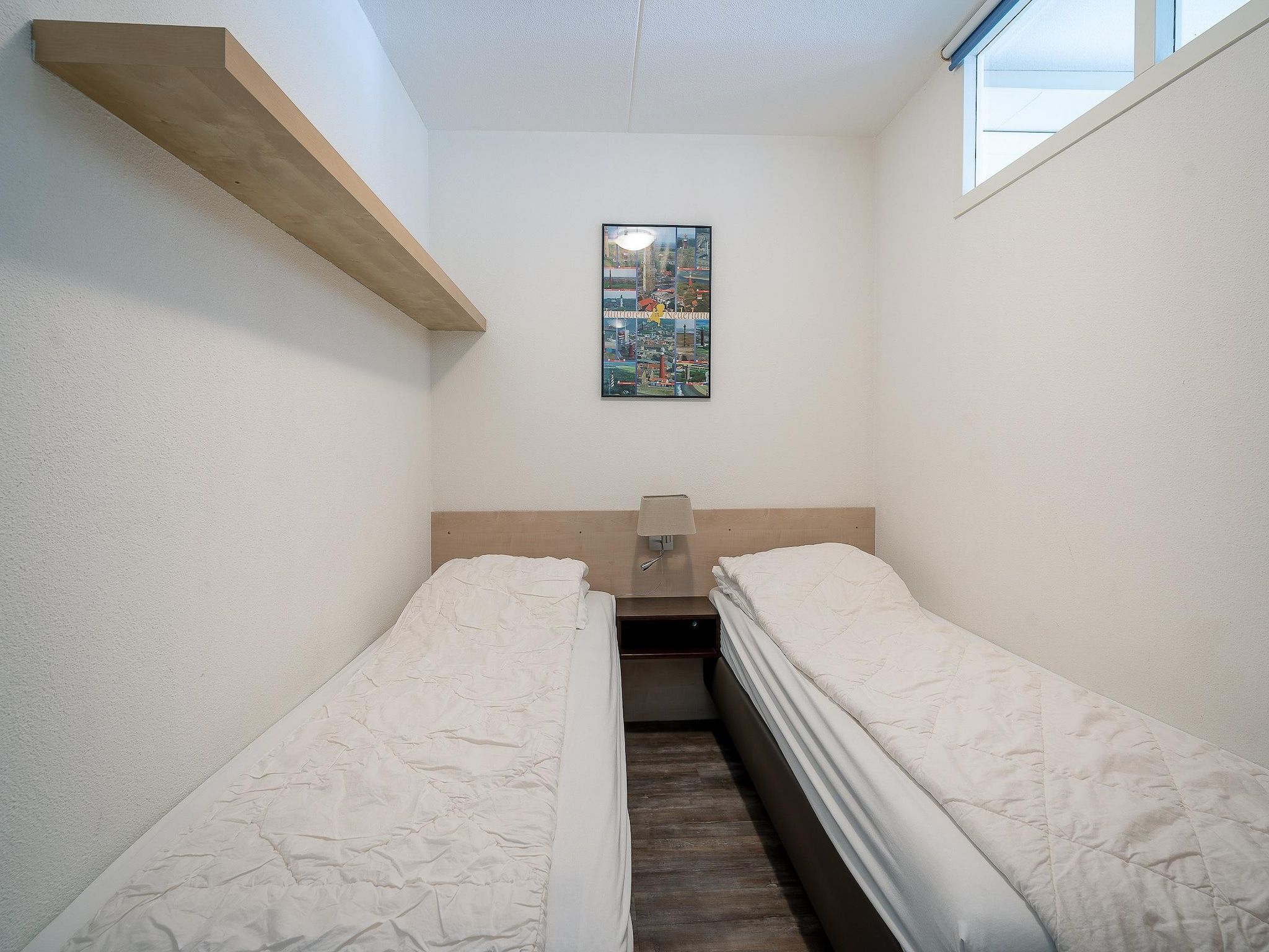 Een slaapkamer van Juliana 096 in De Koog