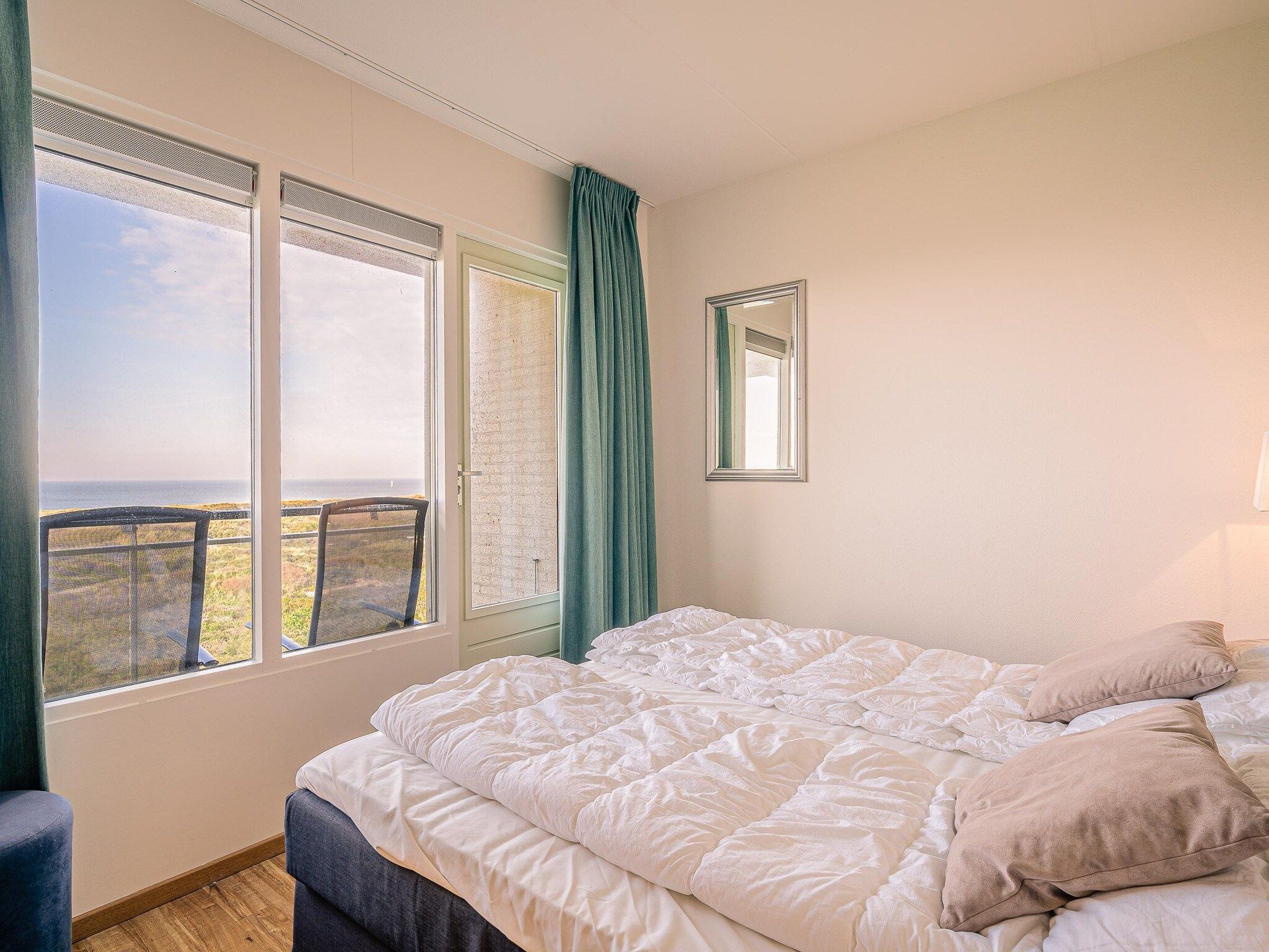 Een slaapkamer van Juliana 102 in De Koog