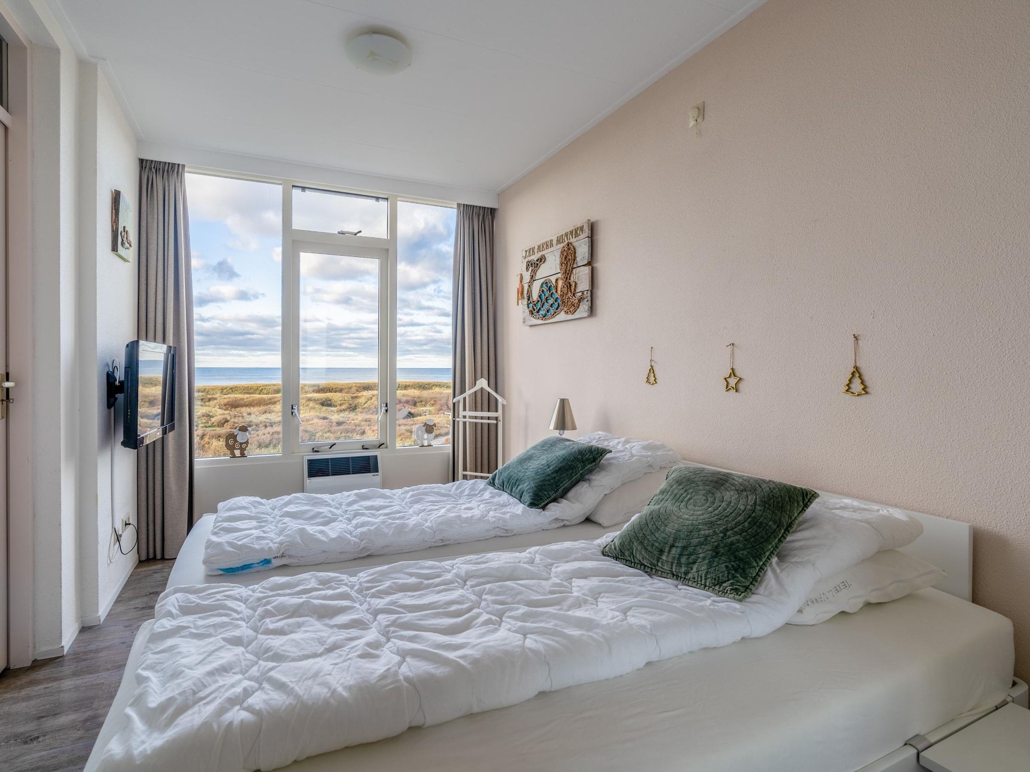 Een slaapkamer van Juliana 114 in De Koog