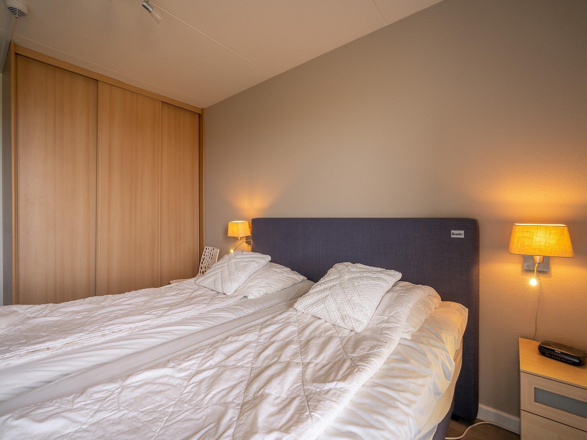 Een slaapkamer van Juliana 116 in De Koog