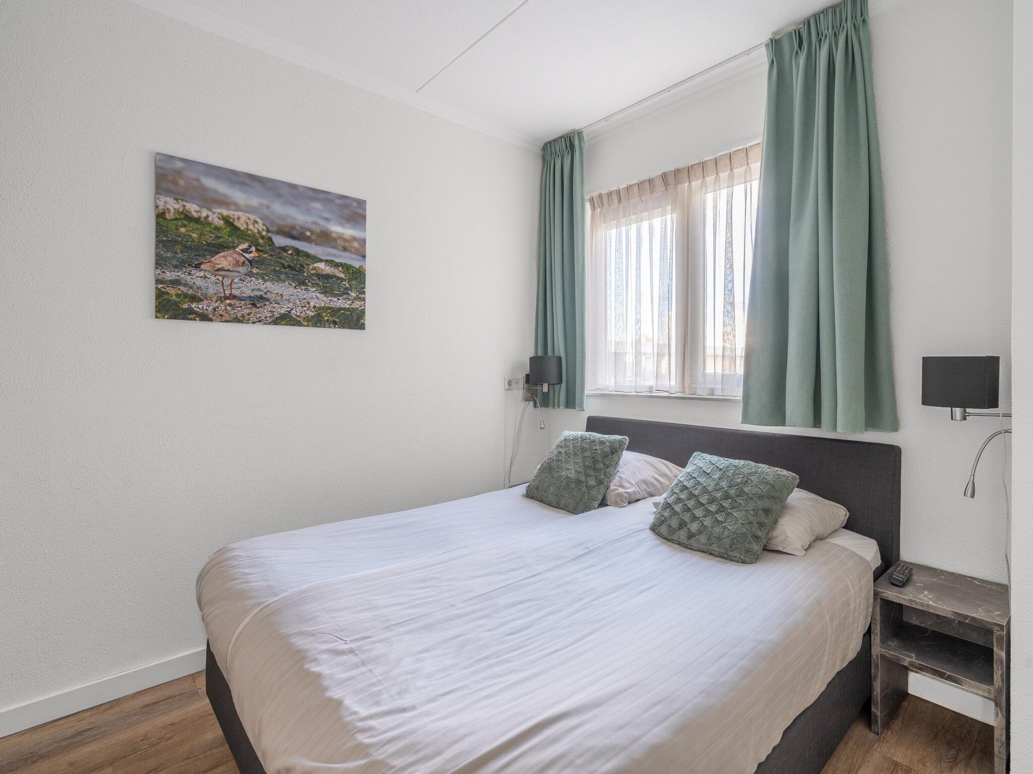 Een slaapkamer van Juliana 136 in De Koog