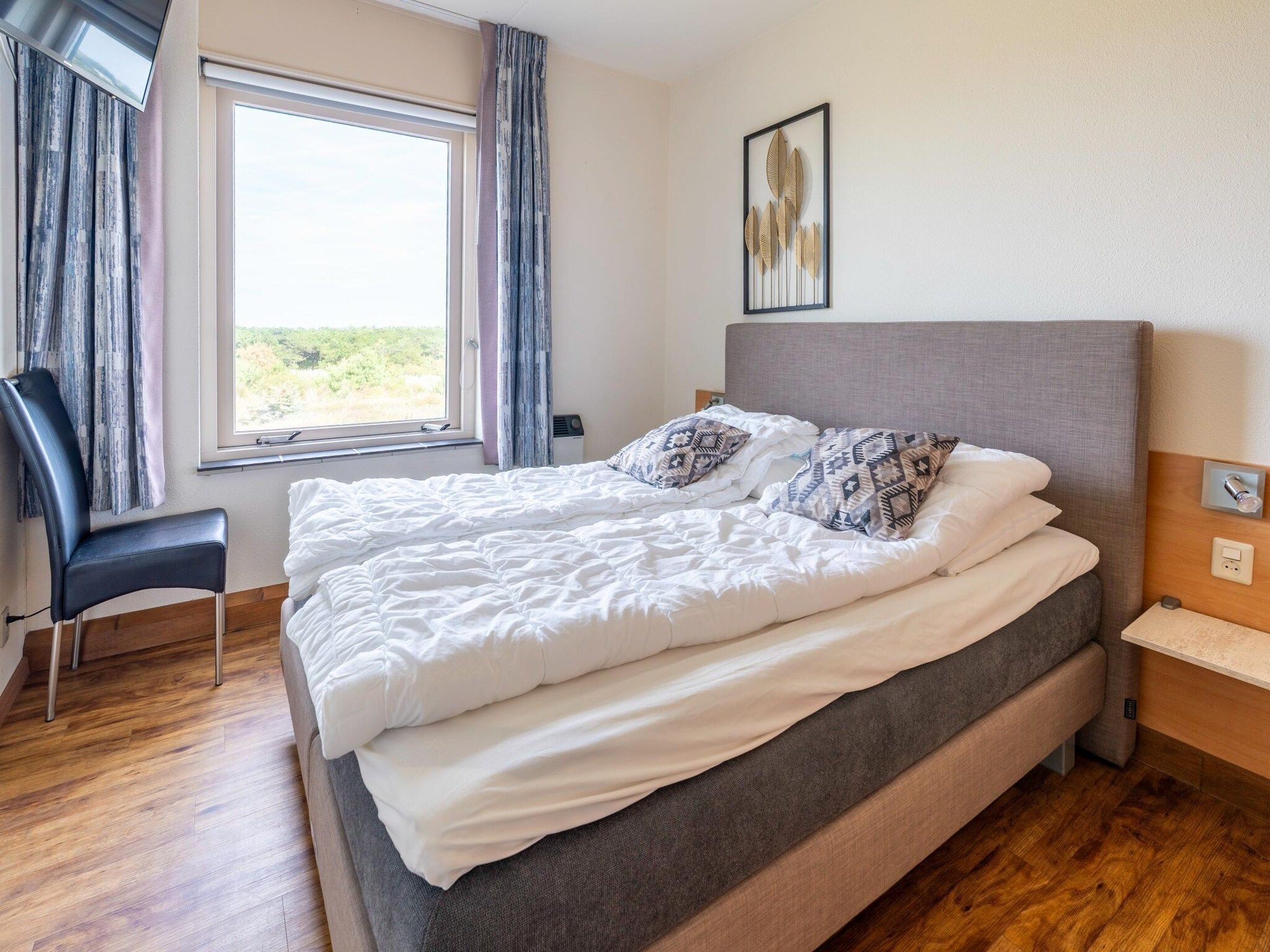Een slaapkamer van Juliana 168 in De Koog