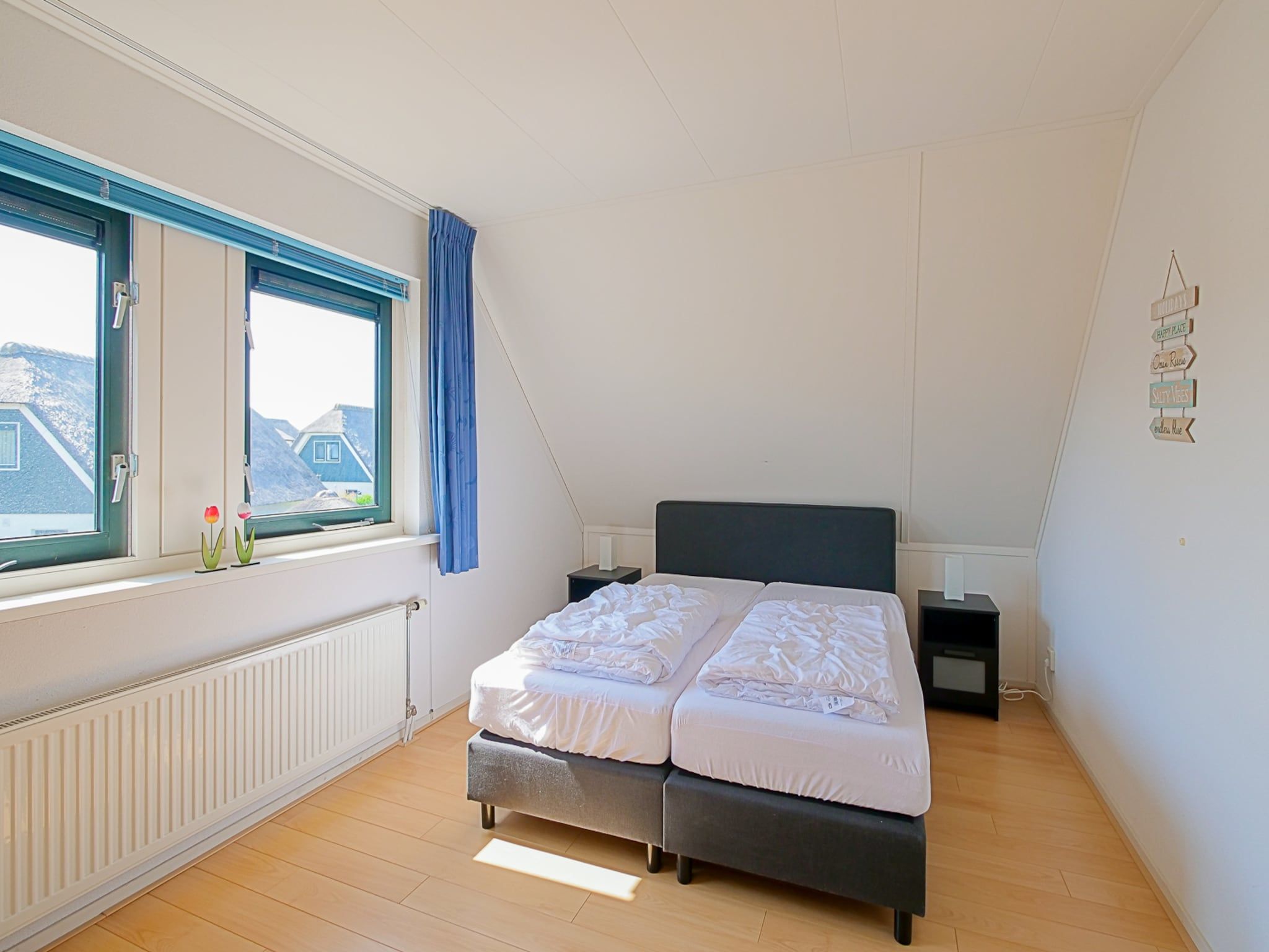 Een slaapkamer van Villa Noorderzon in Julianadorp