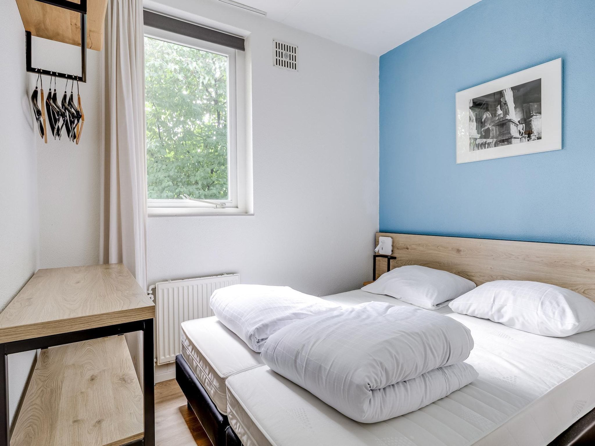 Een slaapkamer van 7 - Persoons Forest 217 Sauna Bungalow (copy) in Ewijk