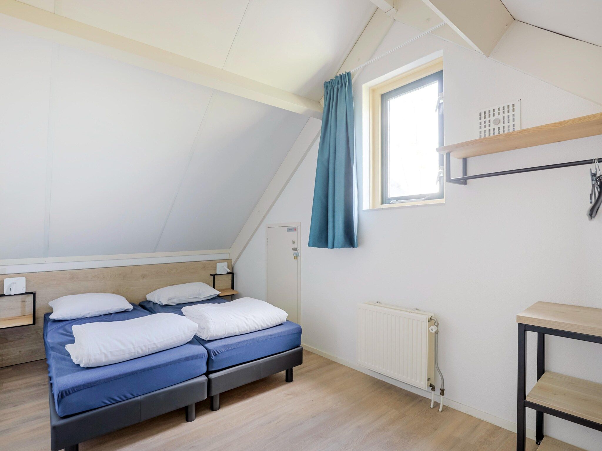 Een slaapkamer van 7 - Persoons Forest 217 Sauna Bungalow (copy) (copy) (copy) in Ewijk