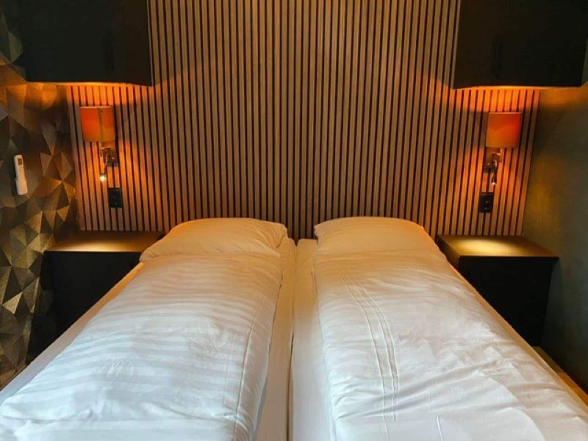Een slaapkamer van Wellnesslodge Merel 2p in Dalerveen