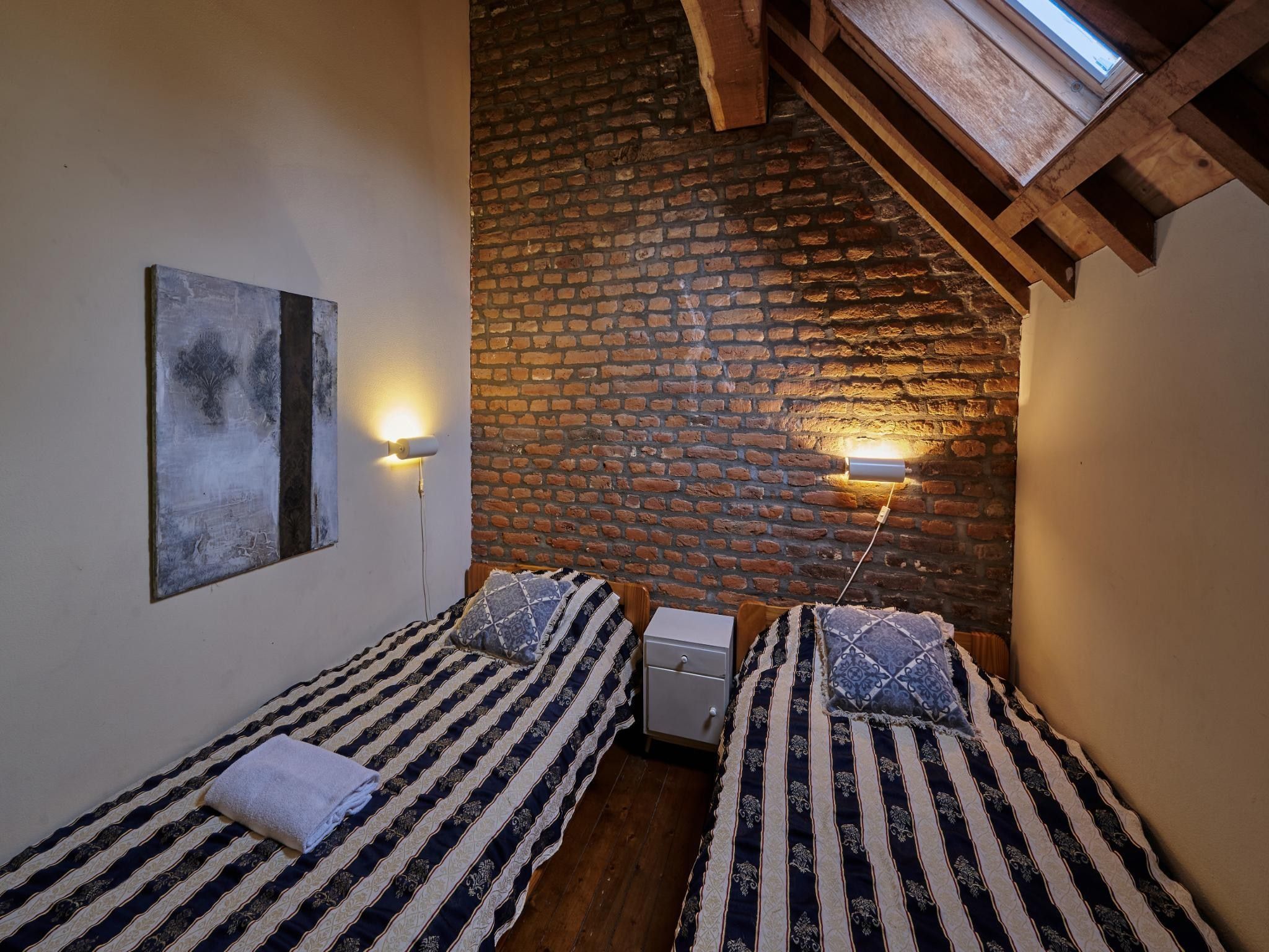 Een slaapkamer van Meschermolen 3 in Mesch-Eijsden