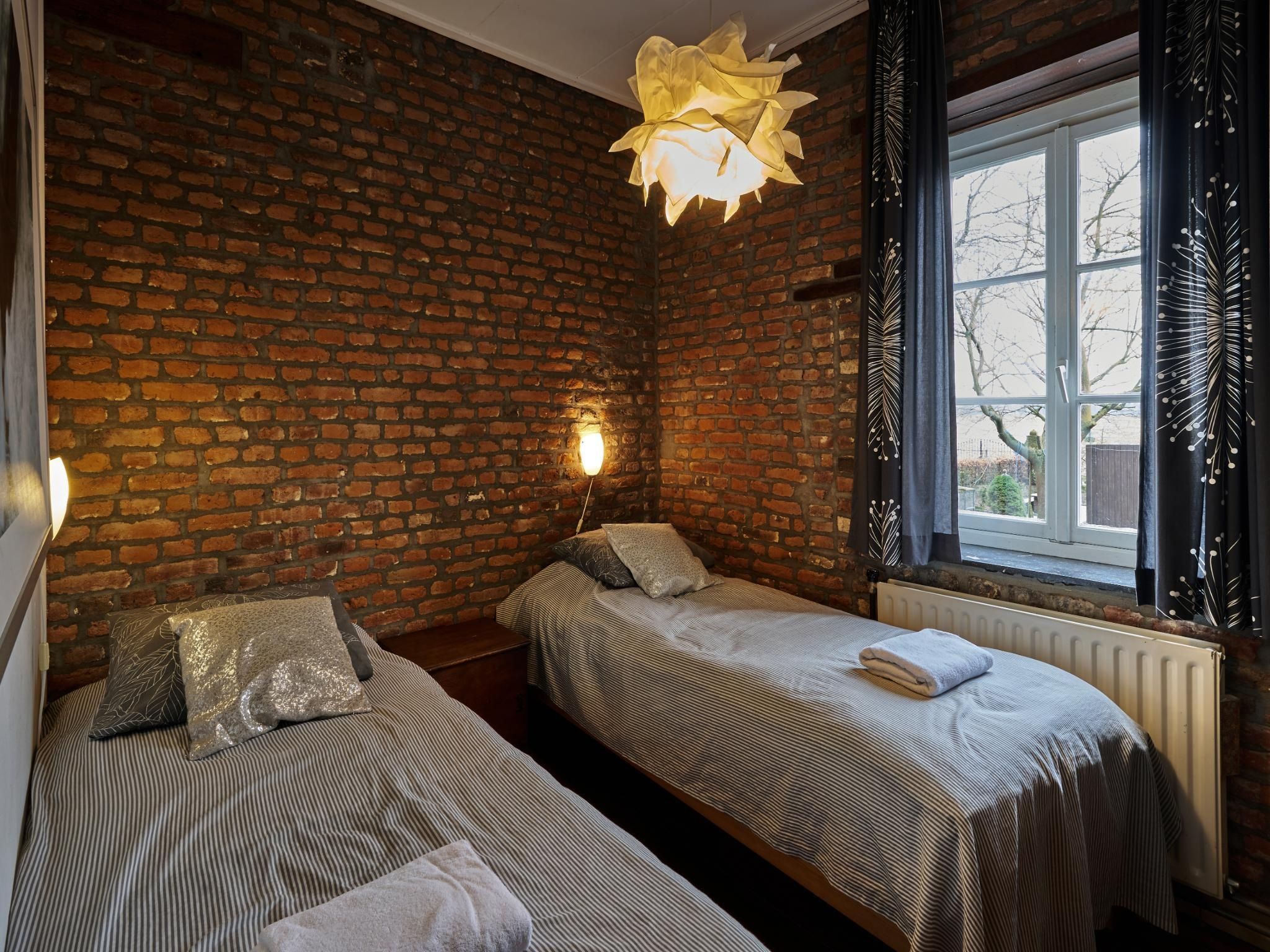 Een slaapkamer van Meschermolen 3 in Mesch-Eijsden