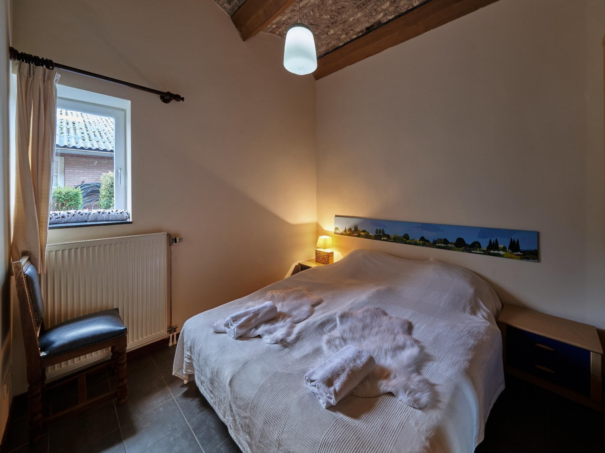 Een slaapkamer van Meschermolen 8 in Mesch-Eijsden