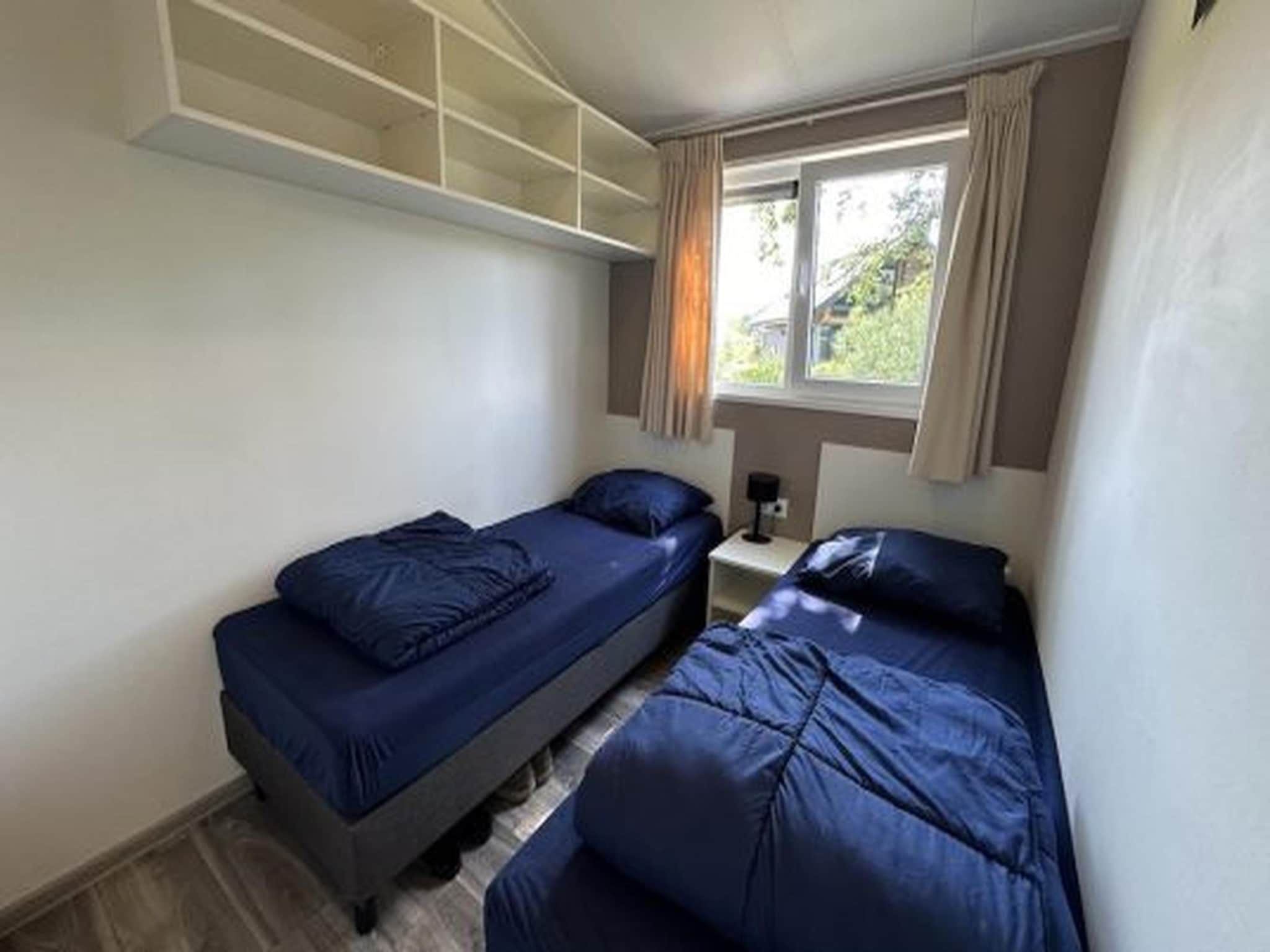 Een slaapkamer van Hackfort kavel 143 in Biddinghuizen