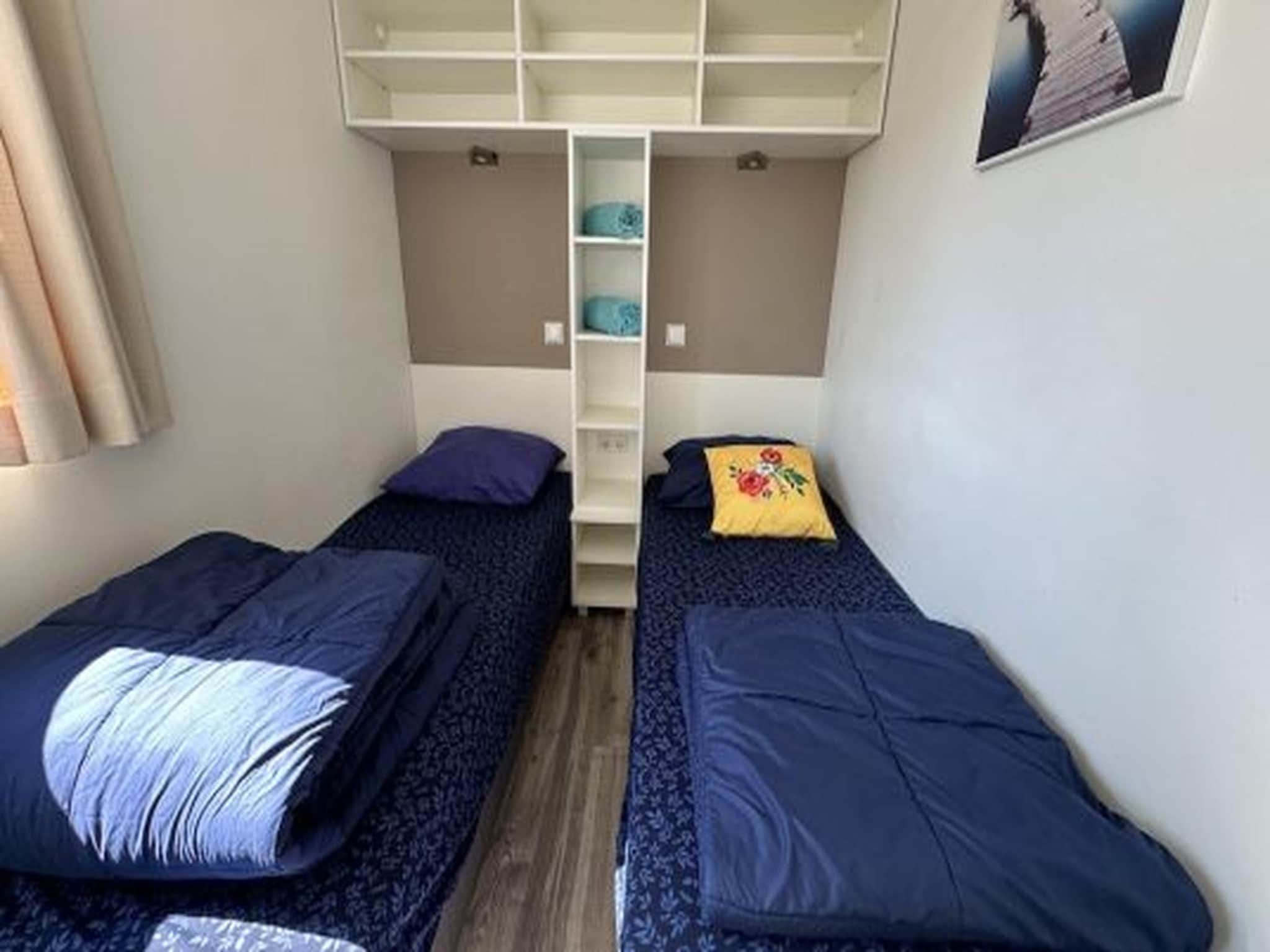Een slaapkamer van Hackfort kavel 143 in Biddinghuizen