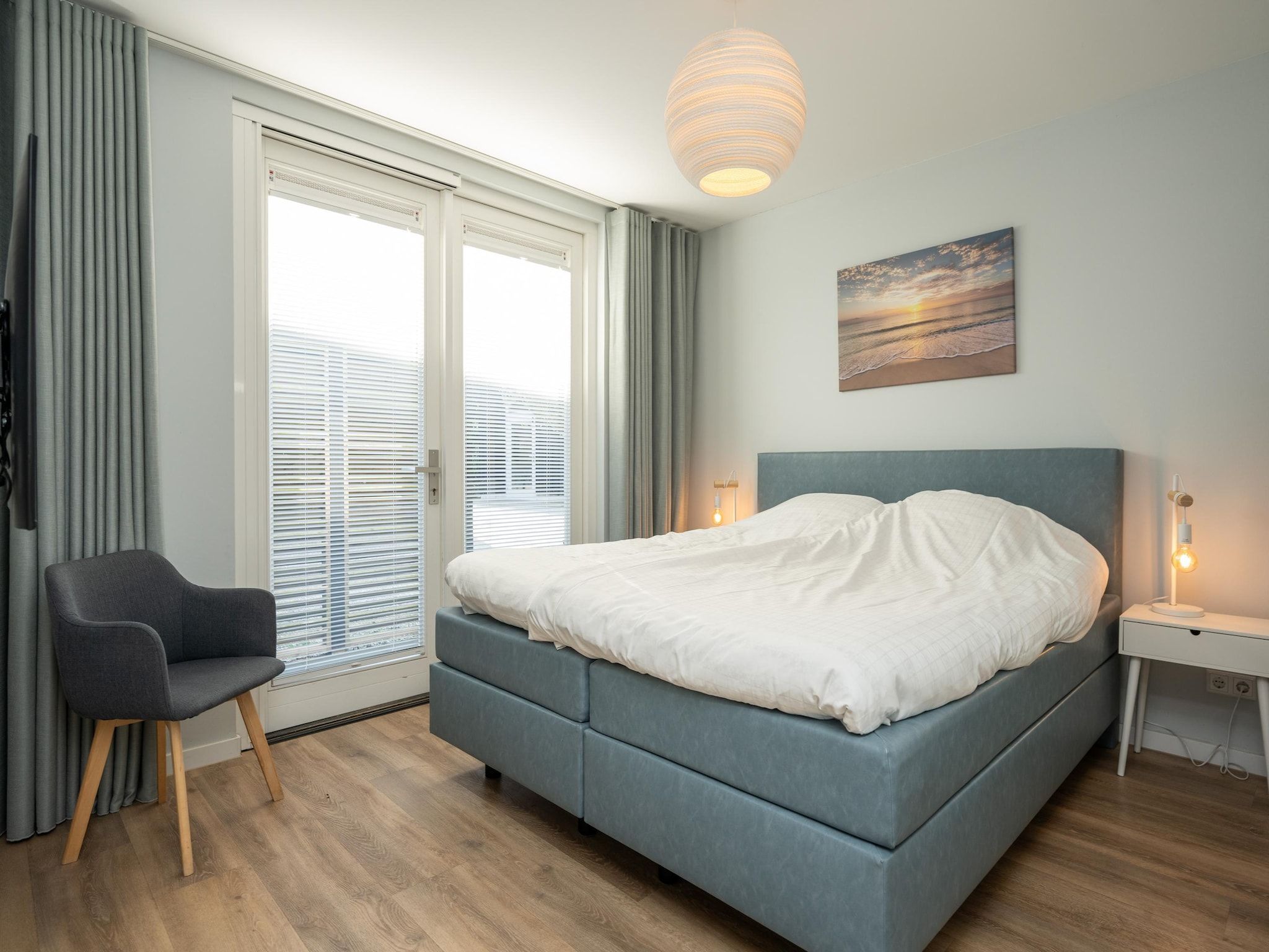 Een slaapkamer van Mienterbos-Duinglop in De Koog