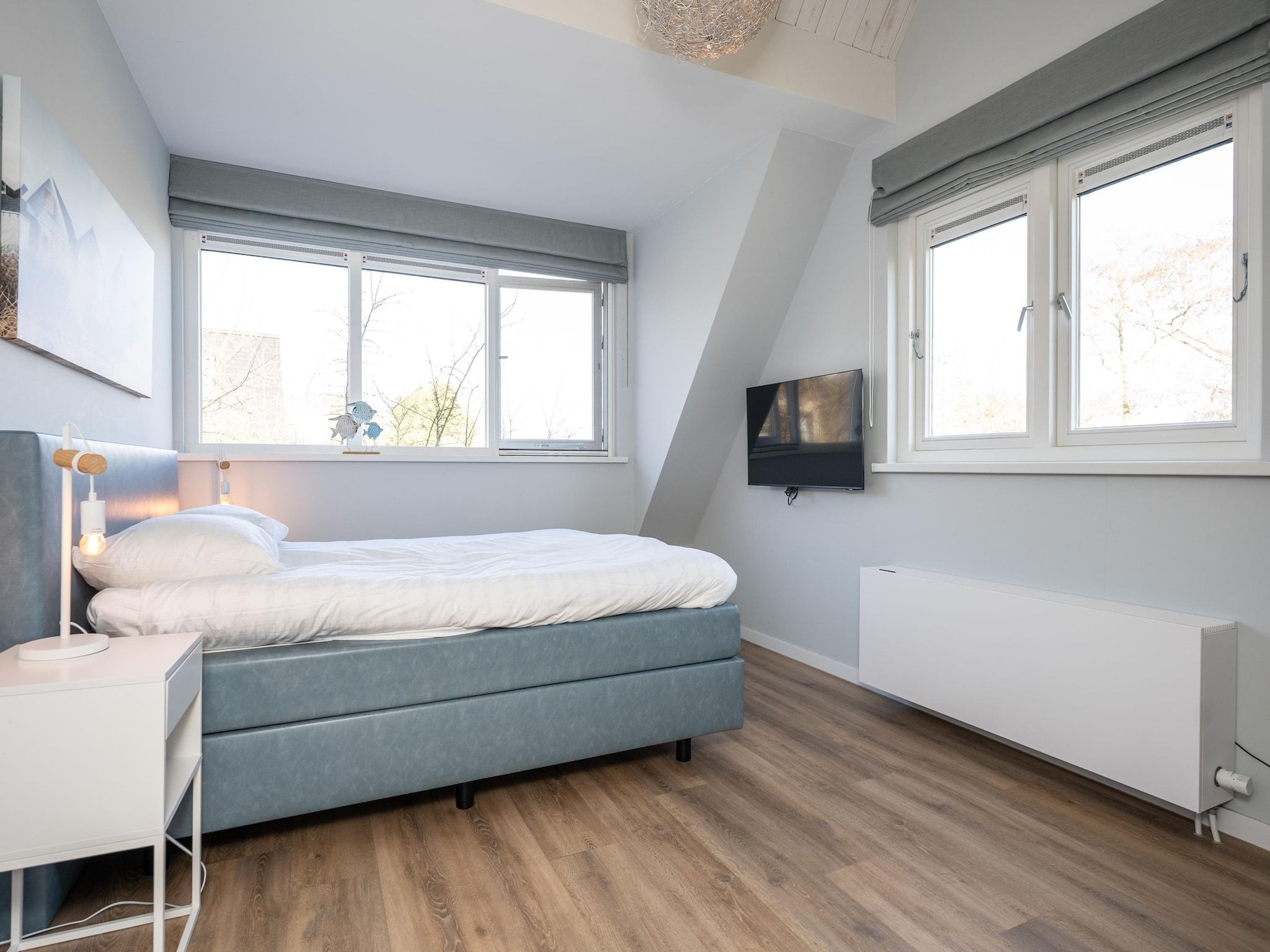 Een slaapkamer van Mienterbos-Duinglop in De Koog
