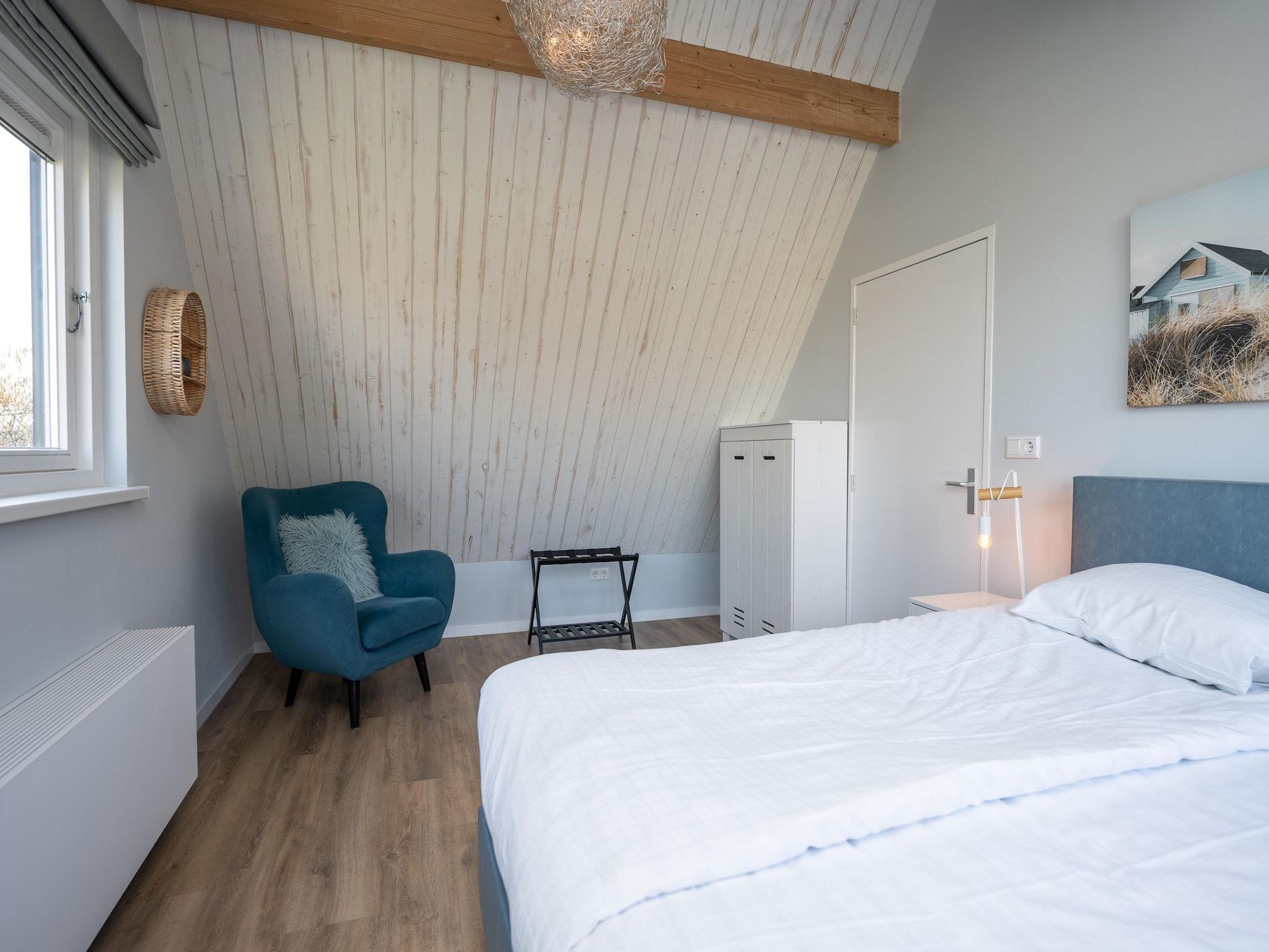 Een slaapkamer van Mienterbos-Duinglop in De Koog