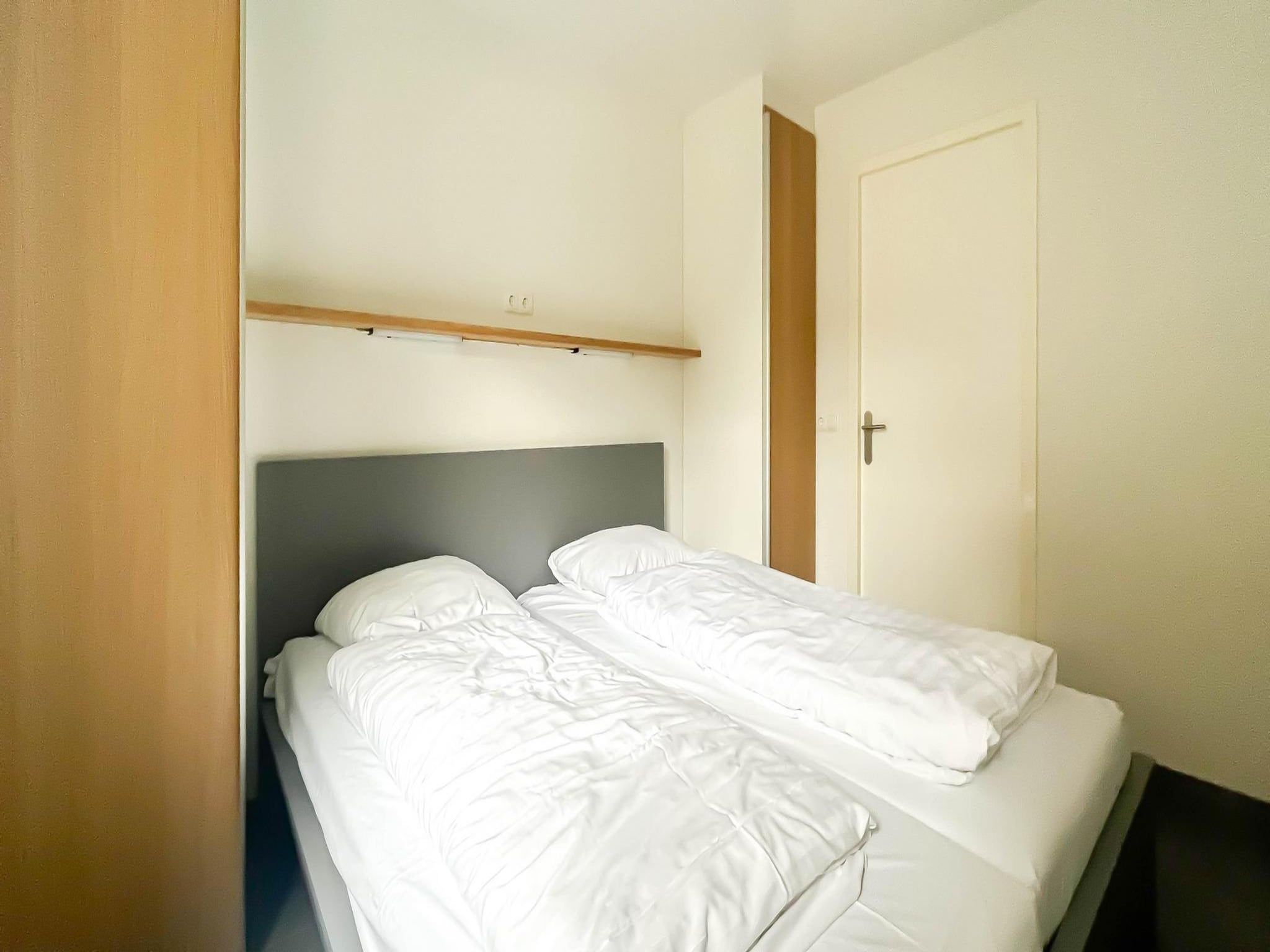 Een slaapkamer van Schelpzicht in Uitgeest