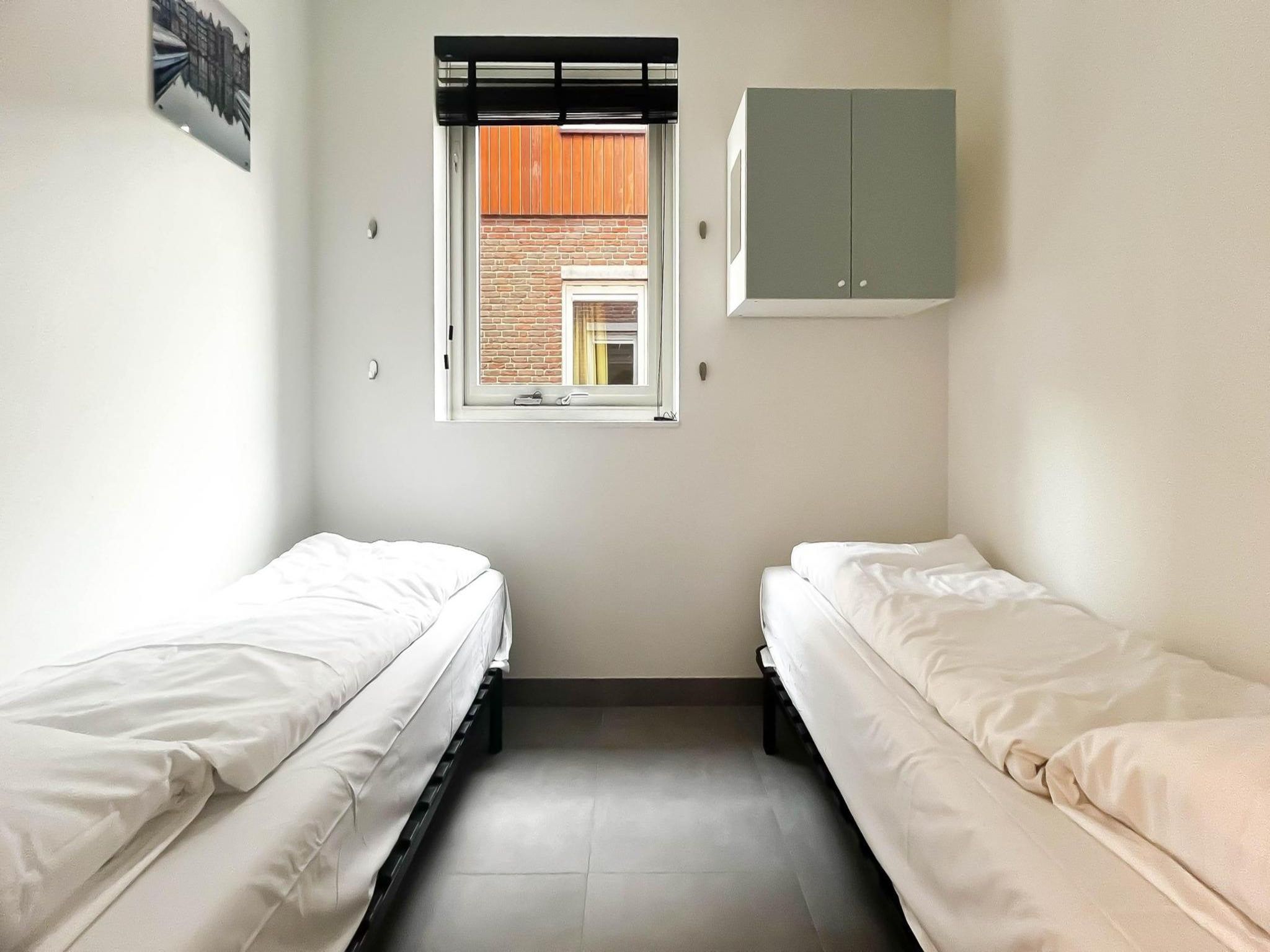 Een slaapkamer van Schelpzicht in Uitgeest