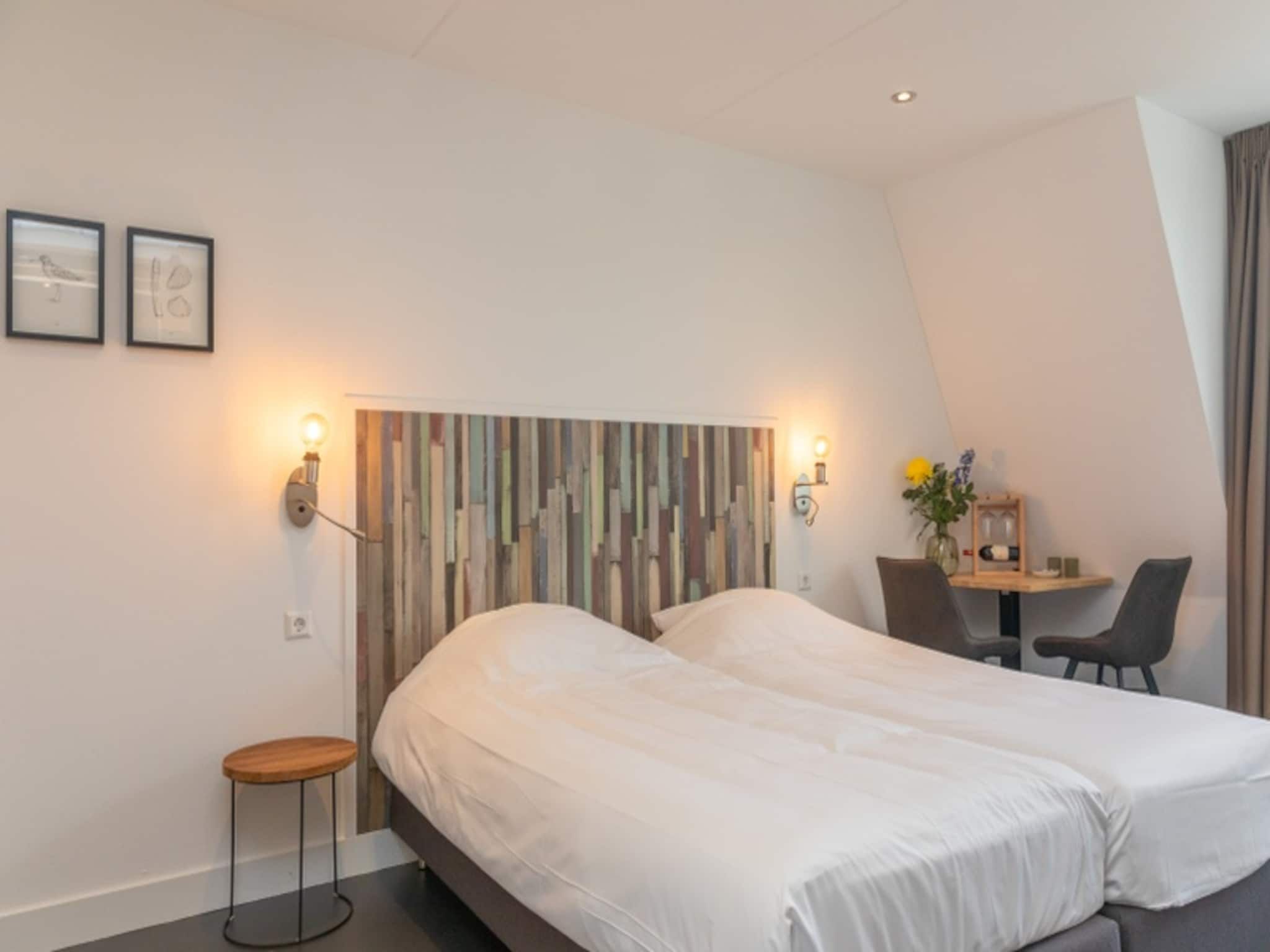 Een slaapkamer van Waddenweelde Texel in Den Burg