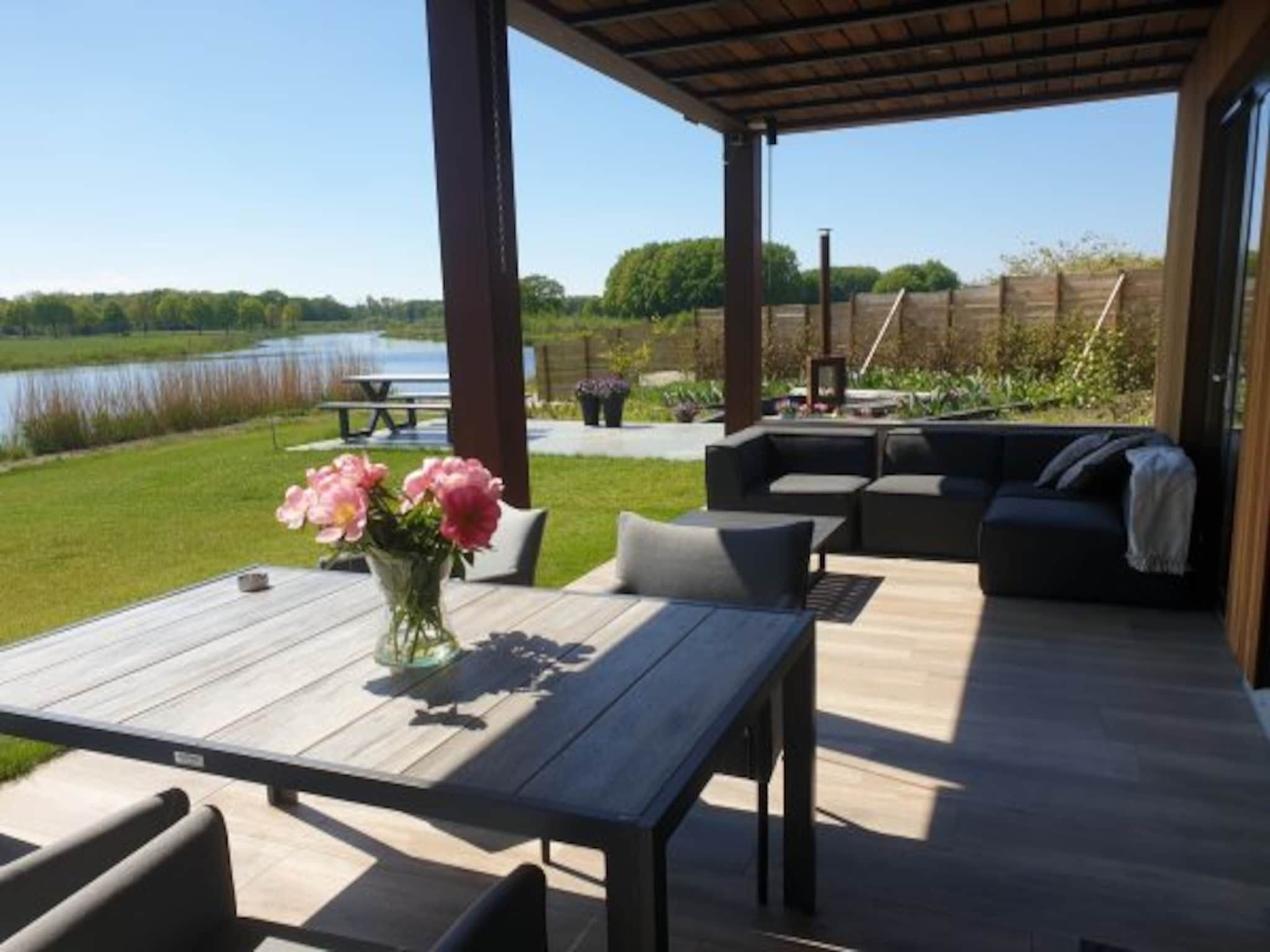 Het terras van Wellness at the Vecht - Ground floor in Dalfsen