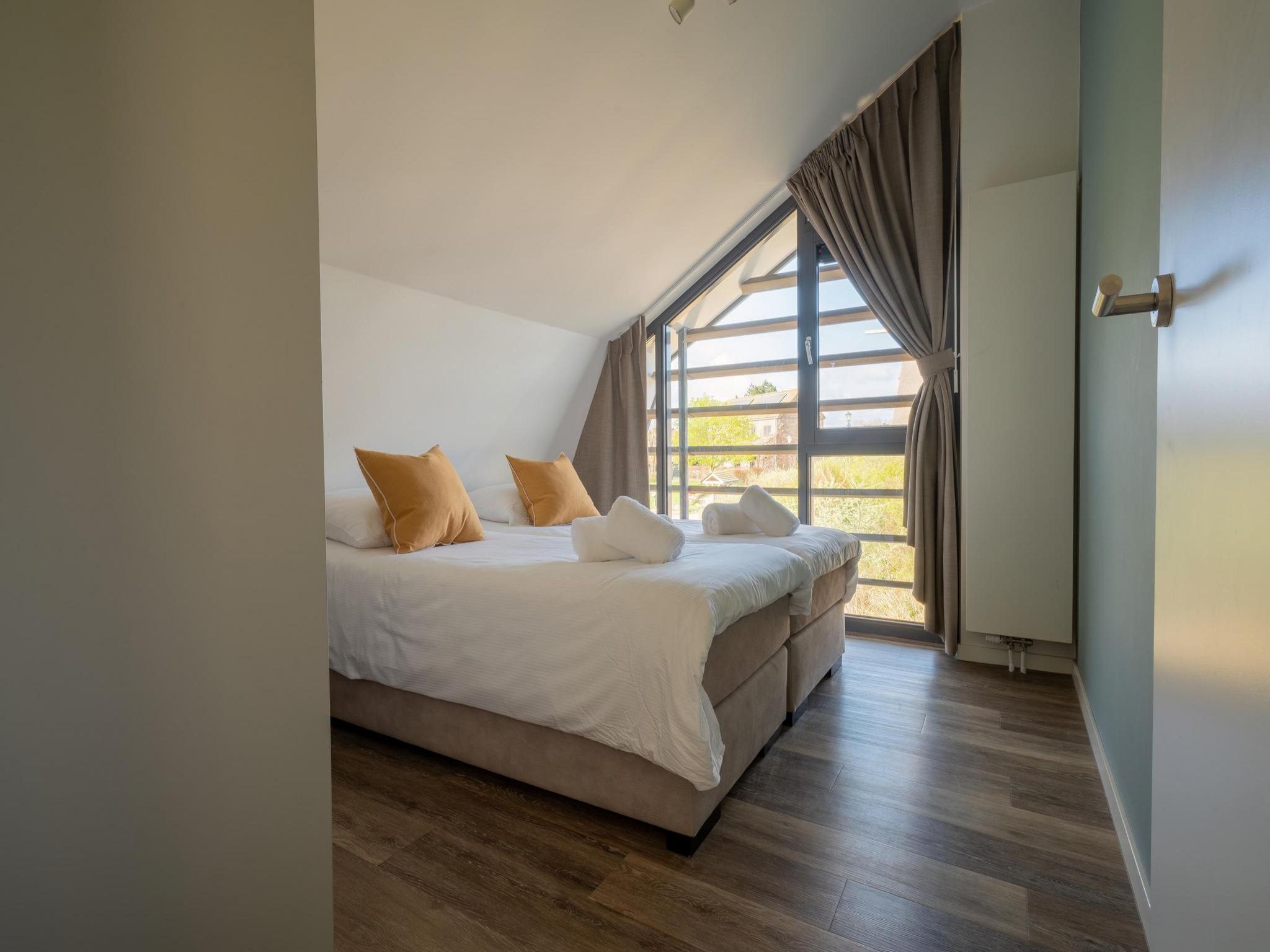 Een slaapkamer van Zicht op de Molen in Egmond aan den Hoef