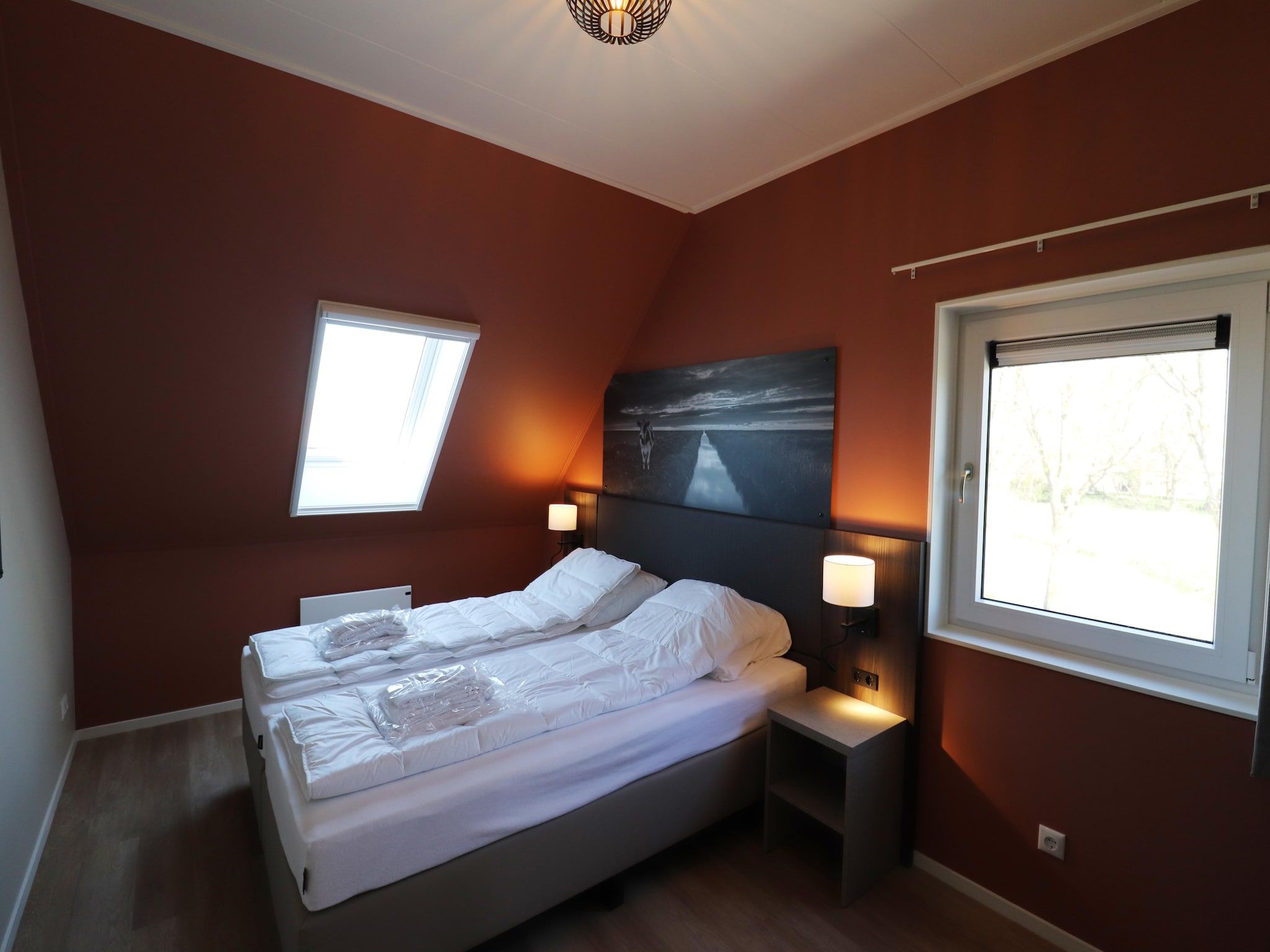 Een slaapkamer van Moderne hoekvilla middenin Friesland in leons