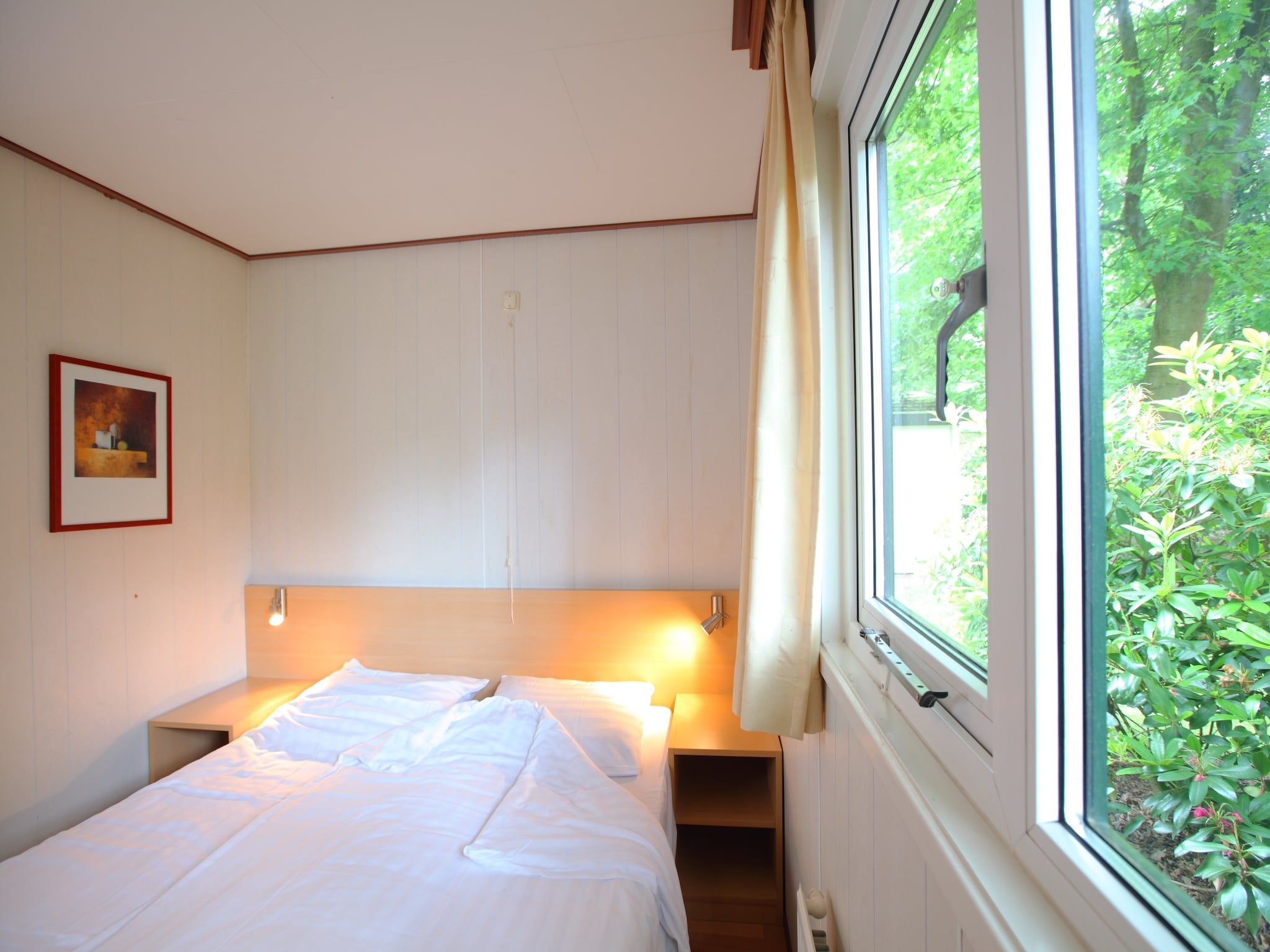 Een slaapkamer van Bospark de Schaapskooi 8 in Wissel/Epe