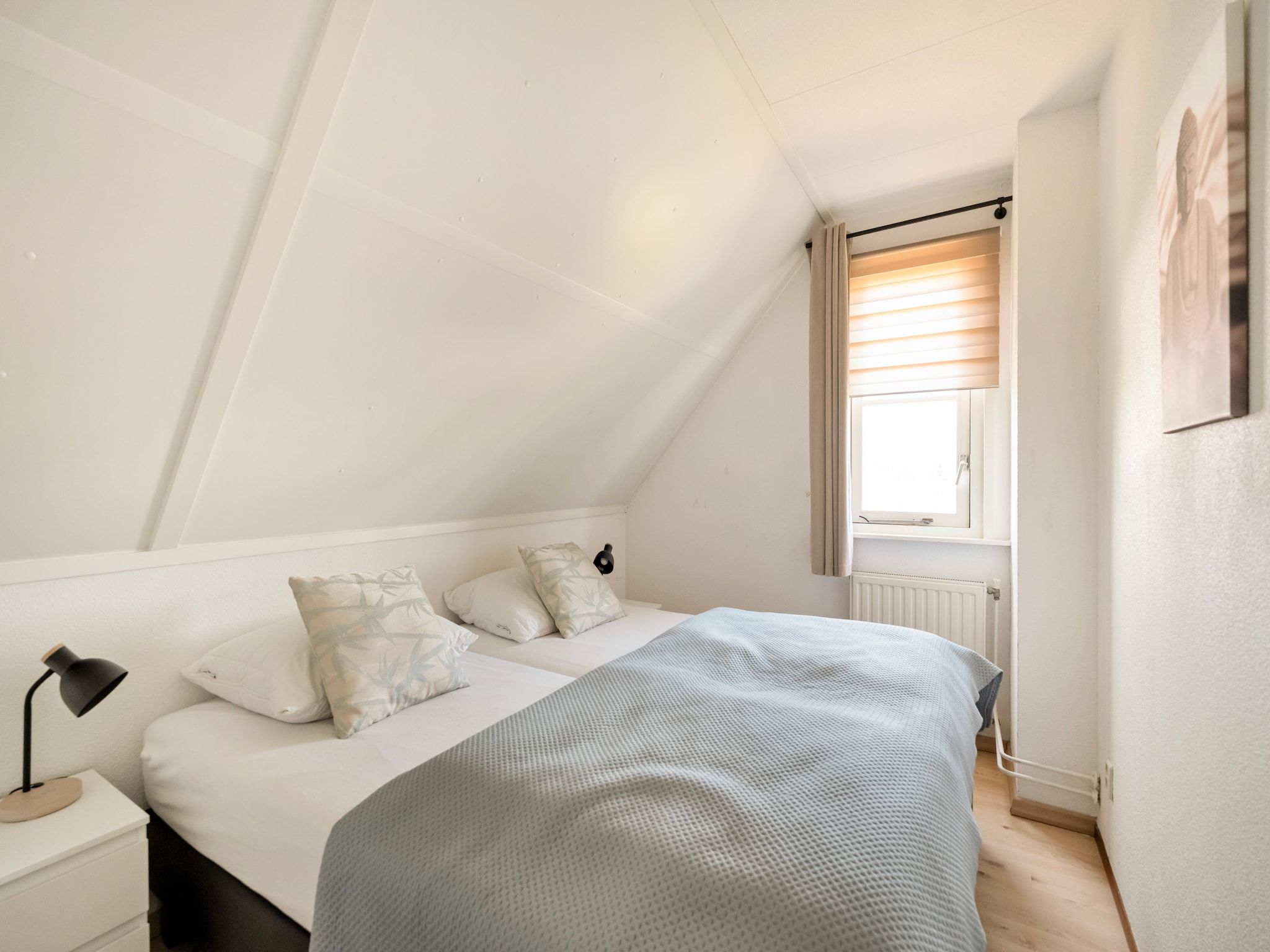 Een slaapkamer van De Buitenplaats 150 in Callantsoog