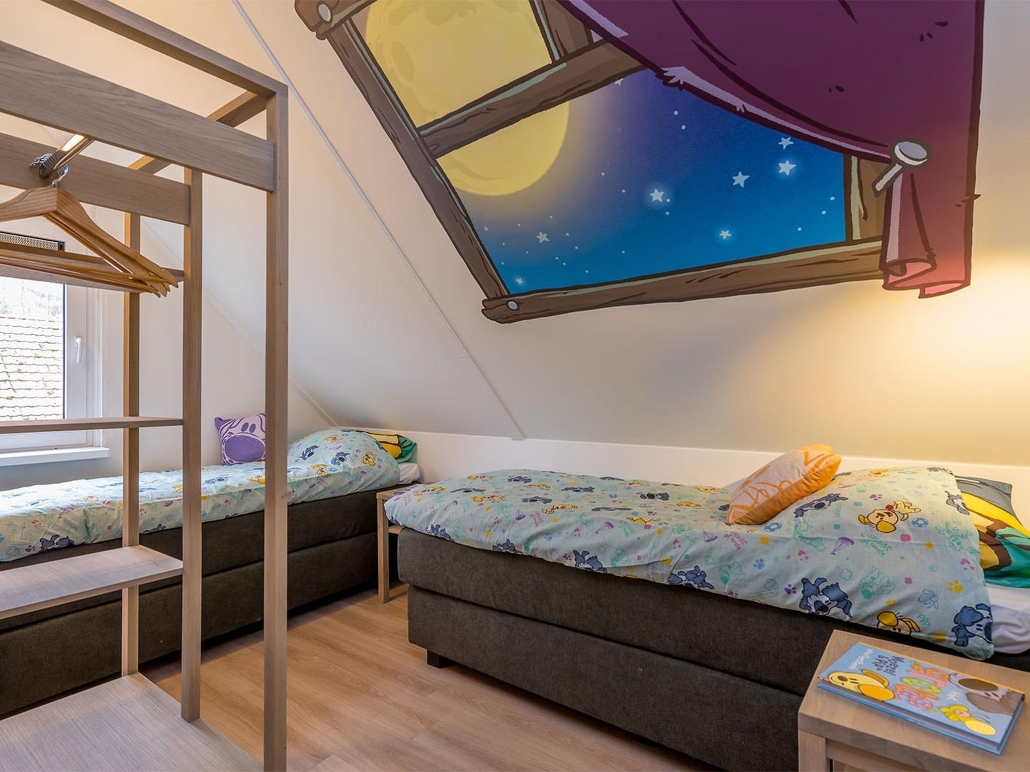 Een slaapkamer van Buurpoes Villa 7p in Hoogerheide