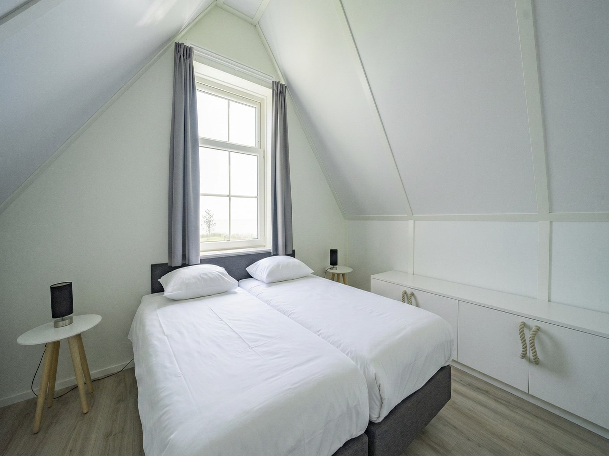 Een slaapkamer van Munt 6 in Uitdam