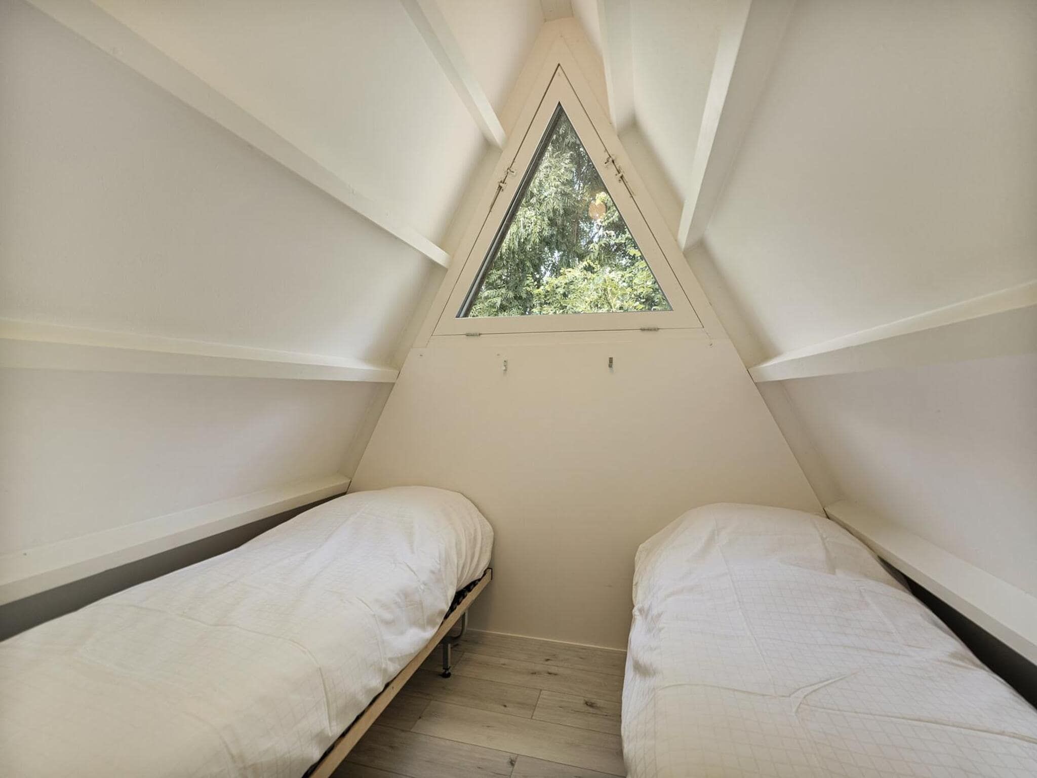 Een slaapkamer van Sandepark 37 in Groote Keeten