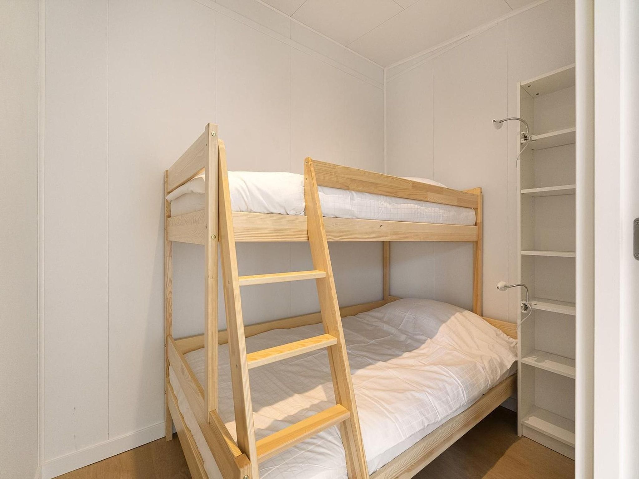 Een slaapkamer van Eureka 57 in Sint Maartensvlotbrug