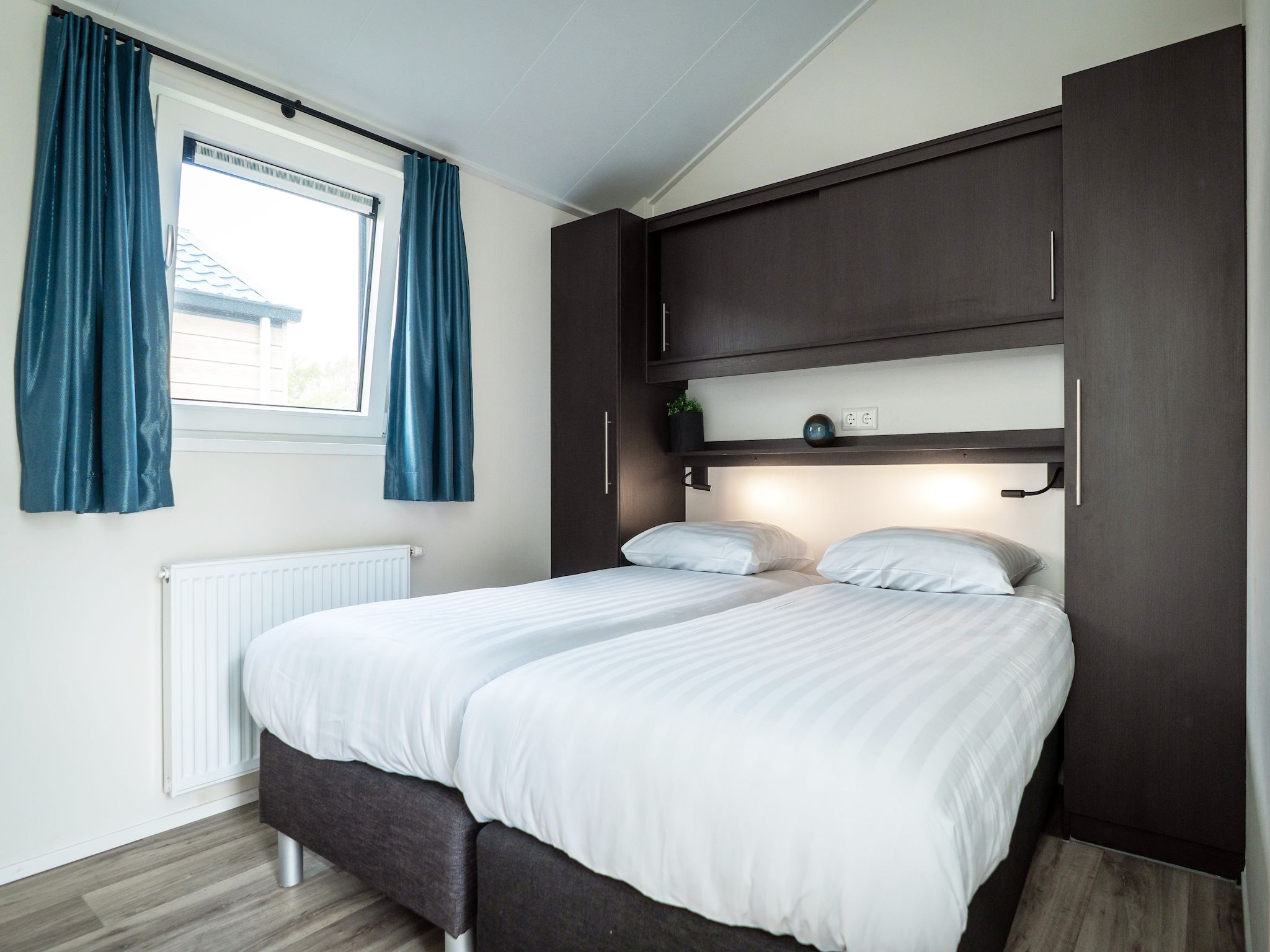 Een slaapkamer van Chalet Comfort in Den Burg