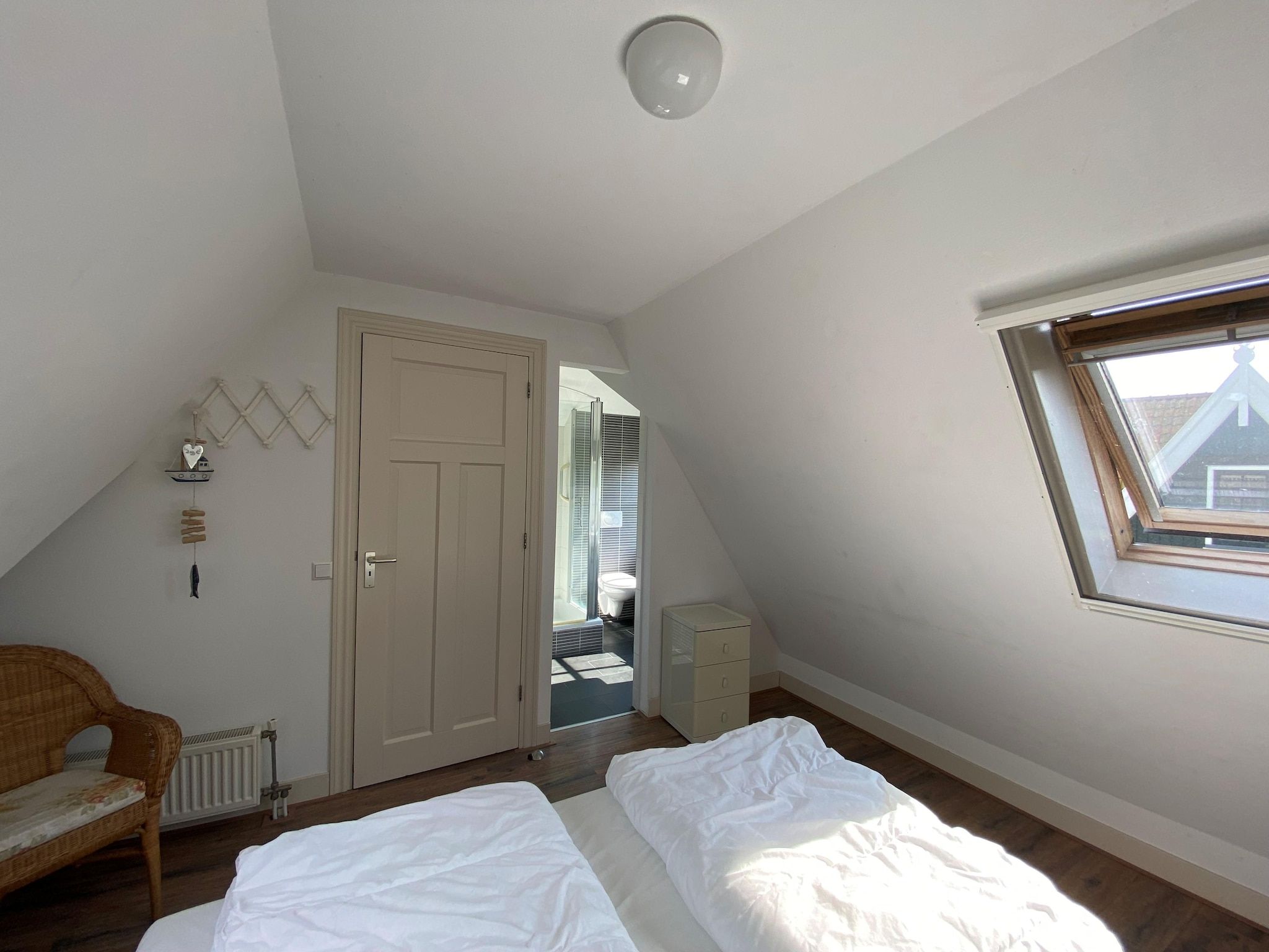 Een slaapkamer van Recreatiepark Wiringherlant  - Villa 10 in Hippolytushoef