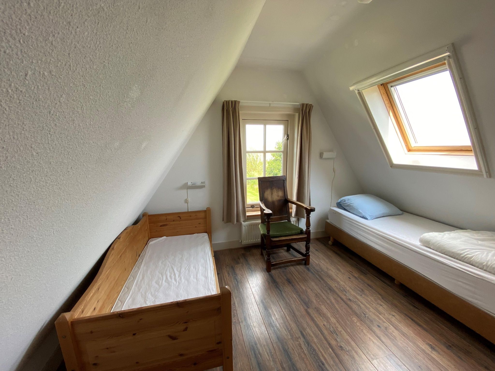 Een slaapkamer van Recreatiepark Wiringherlant  - Villa 10 in Hippolytushoef