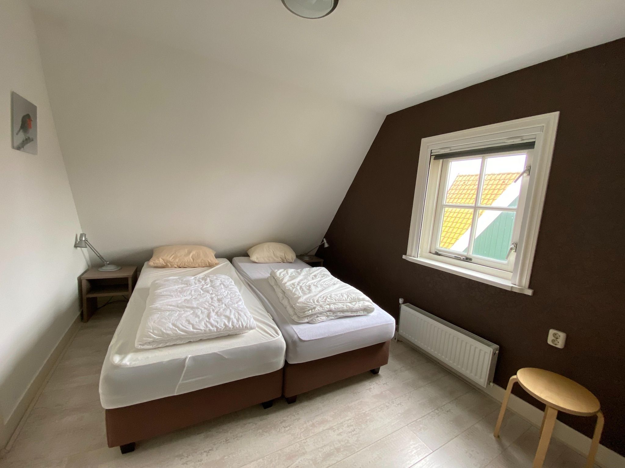 Een slaapkamer van Recreatiepark Wiringherlant - Villa 14 in Hippolytushoef