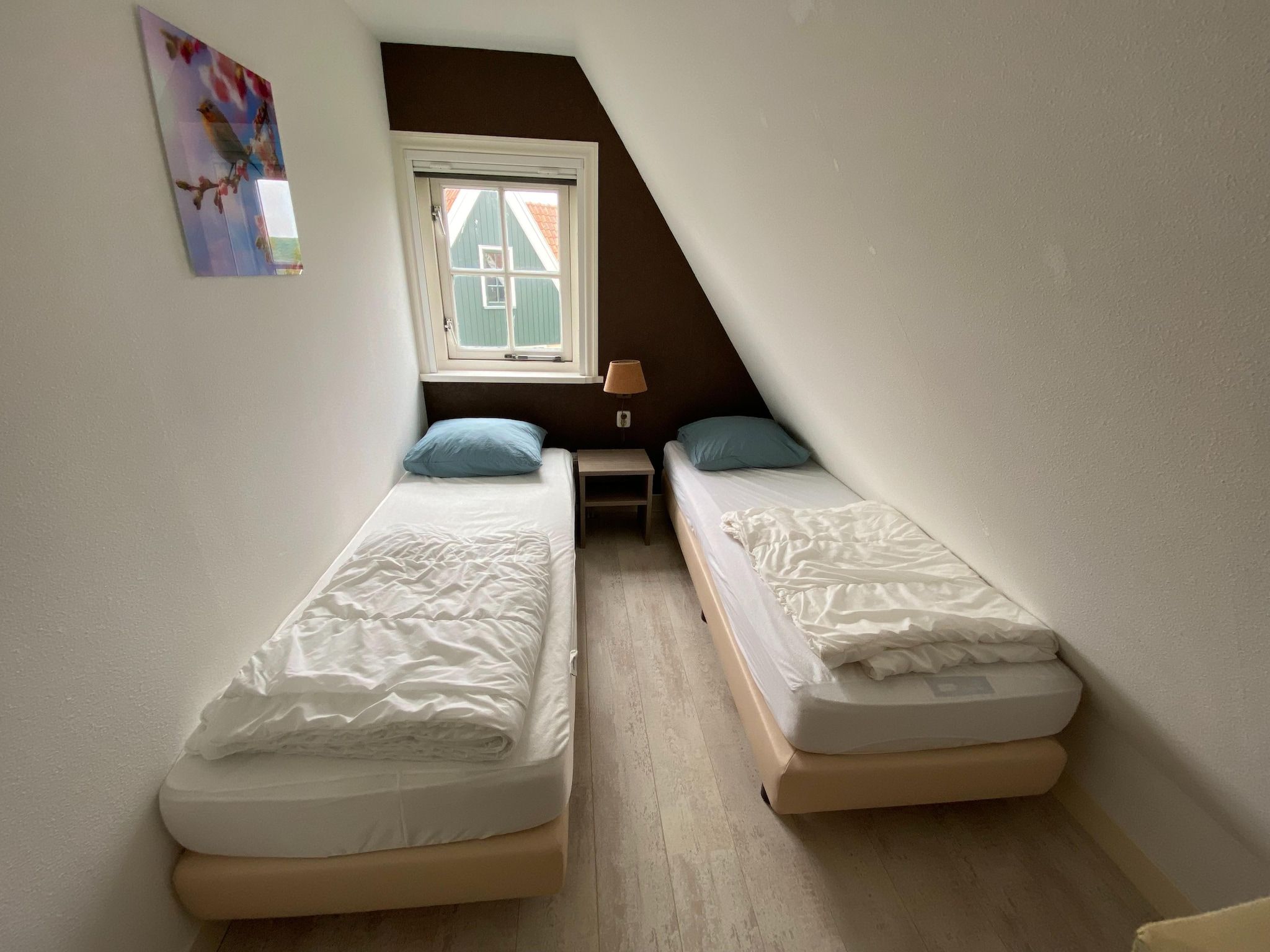 Een slaapkamer van Recreatiepark Wiringherlant - Villa 14 in Hippolytushoef