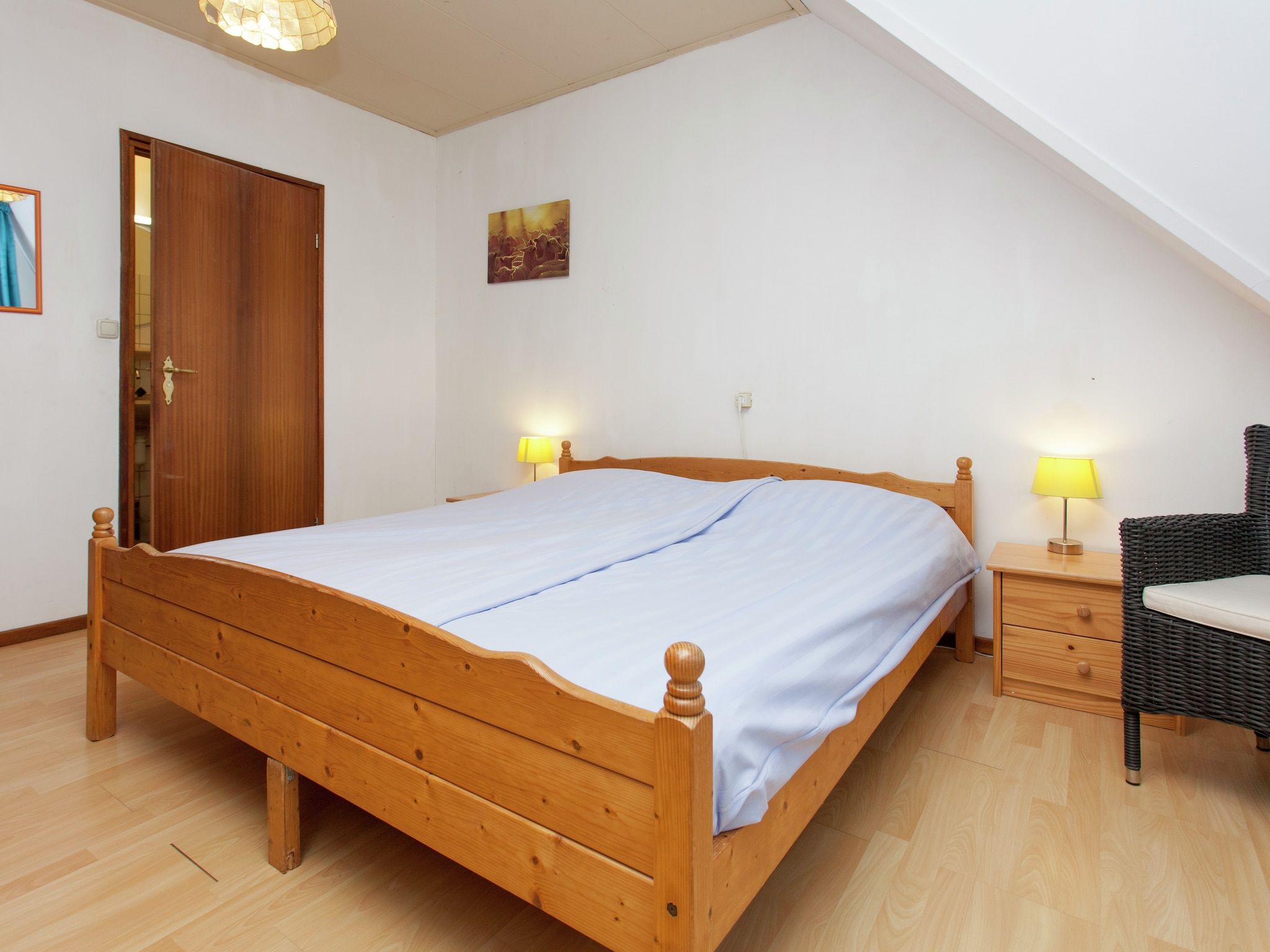 Een slaapkamer van De Vakantie boerderij in Holwerd